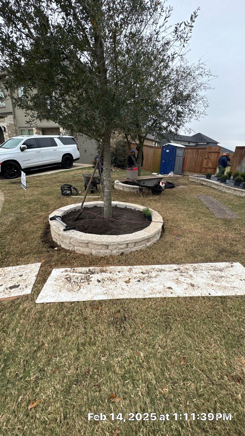 🌿✨ Darlene & Andrew’s Amazing Curb Appeal Transformation  Some projects are more than just landscaping—they’re a conversion of curb appeal from the ground up. For Darlene & Andrew, Alejandro and the Texas Urban Team designed and delivered a complete solution that reshaped their flower beds, solved drainage challenges, and gave new life to the sideyard.  💡 From planning to execution, every step was tailored to build both beauty and functionality:  🌸 Flower Beds, Reinvented  Demolition of old beds, plants, and mulch.  Fresh soil preparation, weed protection, and a brand-new retainer wall built with hand-cut stone and decorative caps.  Carefully selected plants and garden mix to ensure health and visual harmony.  💧 Drainage & Irrigation Upgrades  Outdated corrugated pipes replaced with PVC drainage lines to carry water safely away from the foundation.  New irrigation system combining drip lines and sprinklers—watering plants while keeping the house walls protected.  Sideyard drainage extended with catch basins and PVC piping to prevent water pooling and foundation stress.  🚶 Functional Sideyard with Walkway & Trash Area  Graded and leveled sideyard to manage runoff.  Installed a modern gravel and paver walkway for easy access.  Built a firm and tidy concrete-paver pad for trash containers—making the space both practical and polished.  🛠️ Stonework & Craftsmanship  Every stone in the retainer wall was cut, set, and secured by the team of handcrafters, ensuring a durable build that doubles as a design statement.  ✅ Outcome: Darlene & Andrew’s property now has better drainage, a clean and organized sideyard, and elegant new flower beds—all designed for long-term durability and lasting beauty.  📢 Before hiring anyone, review our portfolio. Our work speaks louder than words—each project is a blend of function, protection, and design crafted to last. by Texas Urban Elements