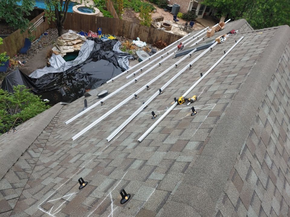 Residential Roof Replacement and Solar Panel Integration in Austin by Caliber Restoration LLC