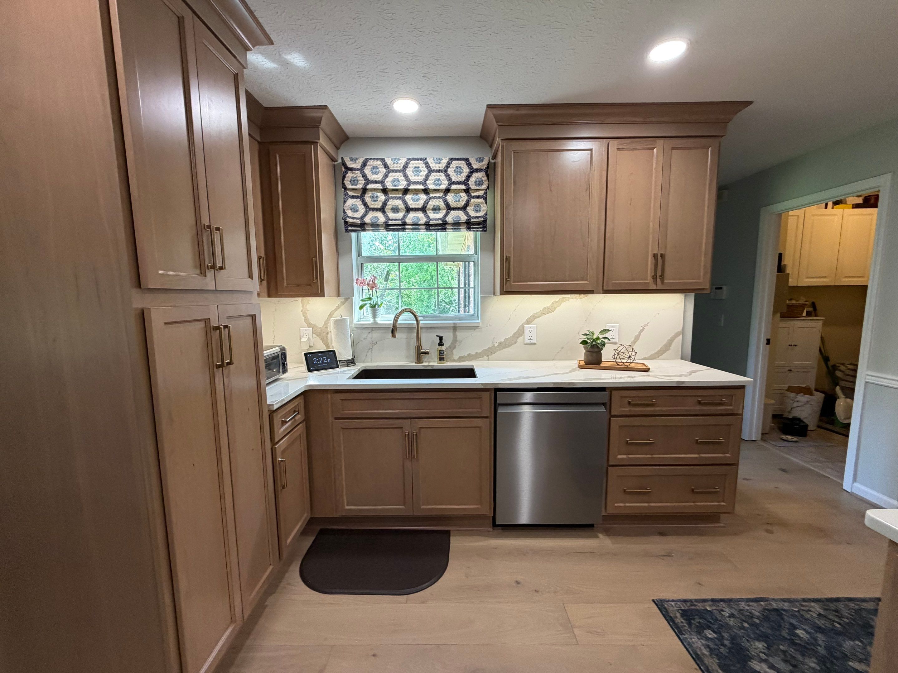 Modern Kitchen Remodel Featuring Quartz Backsplash, under cabinet lighintg, and a coffee bar in Mt. Juliet Tennessee by DeRo Renovations,LLC