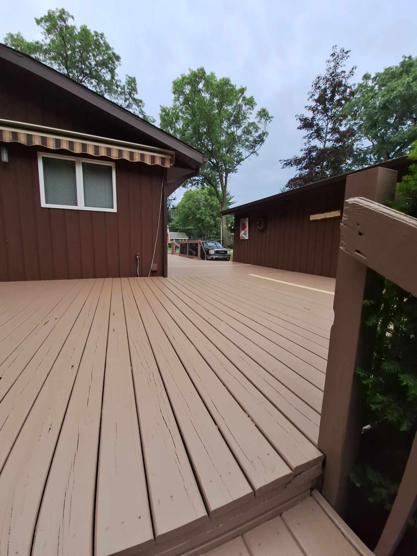 Muskegon Deck Restoration with Pressure Treated Railings and Wood Staining by Gordon Painting