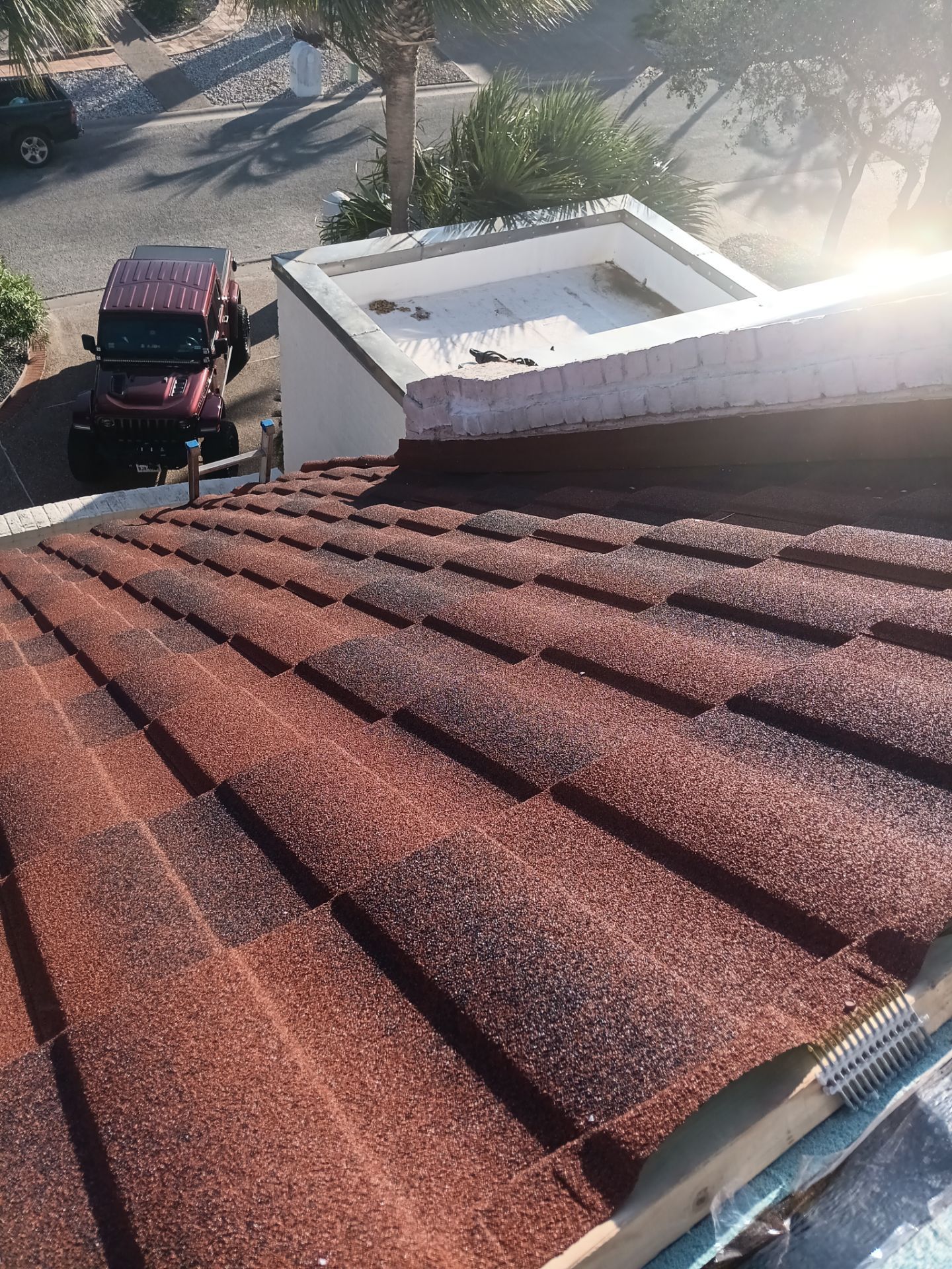 Off with the Tile and on with the TILCOR stone coated metal.  by Bayfront Roofing and Construction
