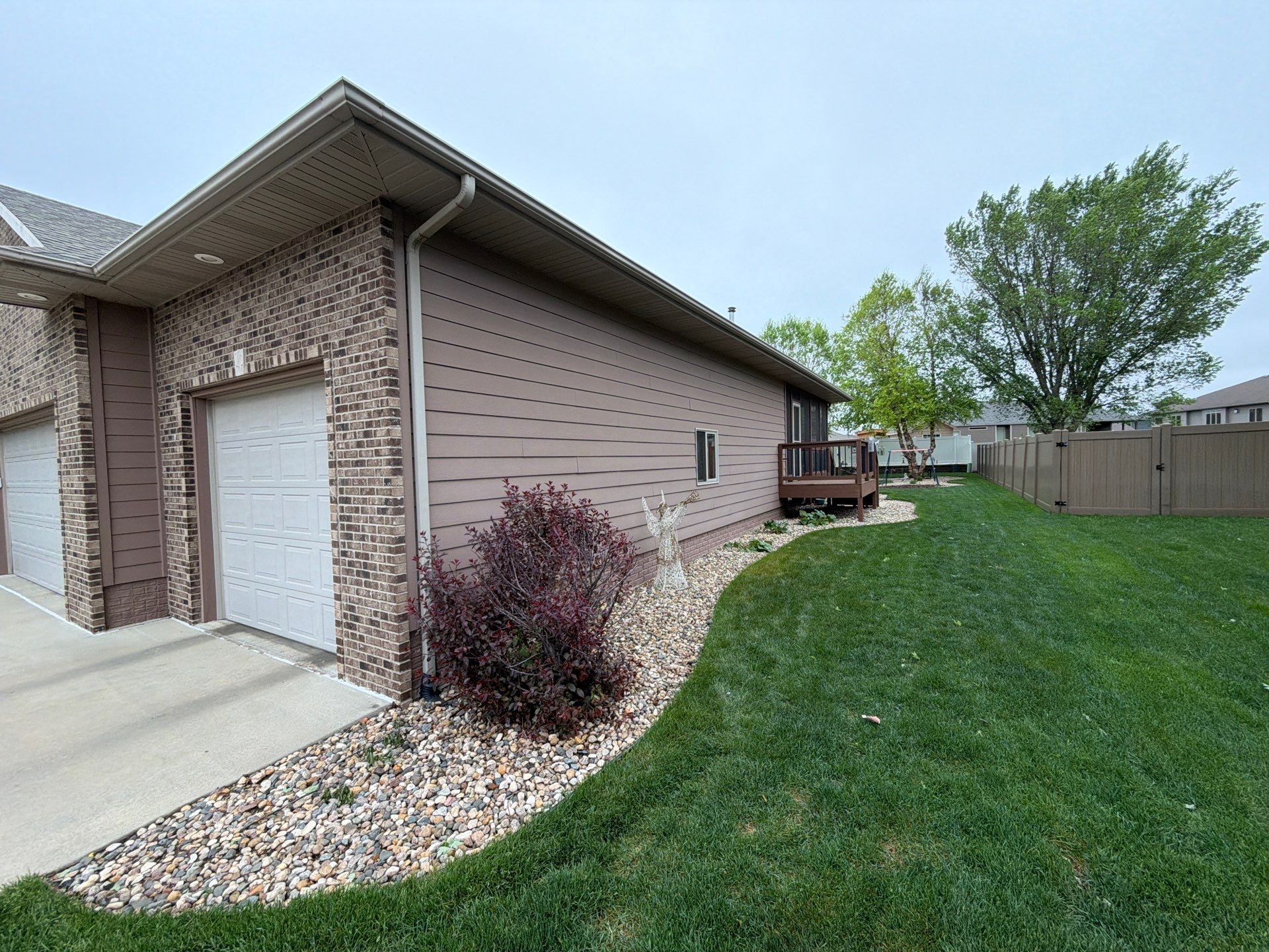 Exterior Painting and Wooden Deck Staining in Sioux Falls by Select Painting, Coatings & Garage Cabinets