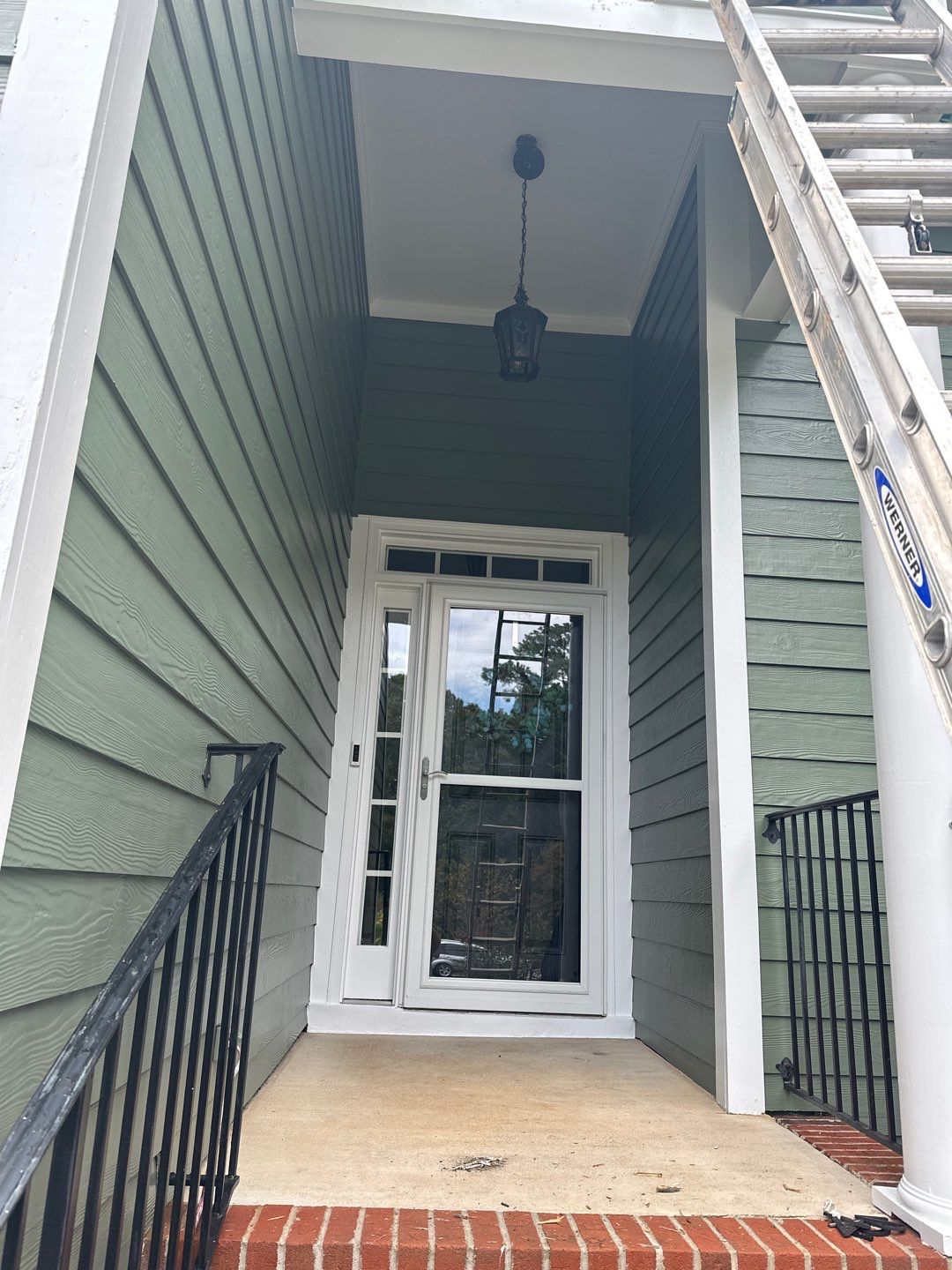 Raleigh Siding and Window Replacement with Custom Green Finish by The Remodeling Company