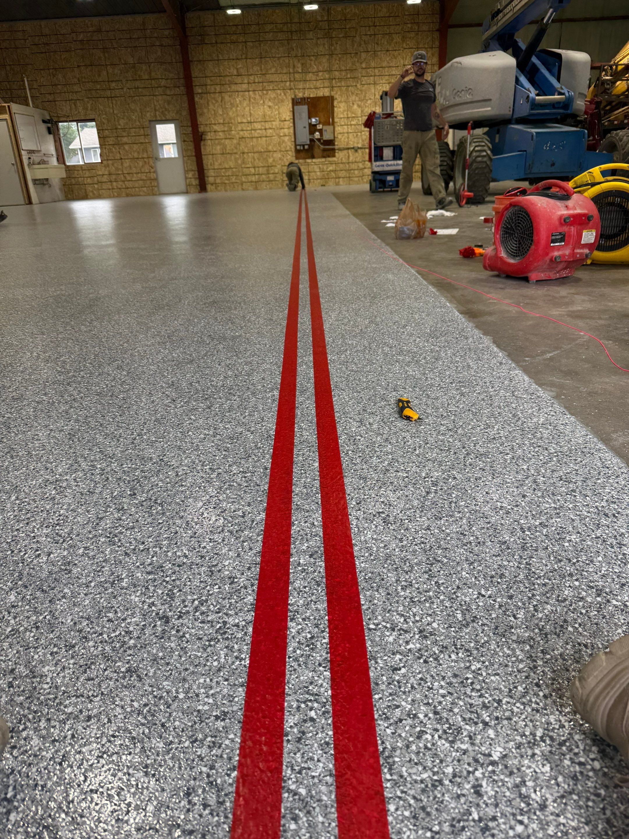 Custom Polyurea Shop Floor with Basketball Court Lines in Rock Valley by Select Painting, Coatings & Garage Cabinets