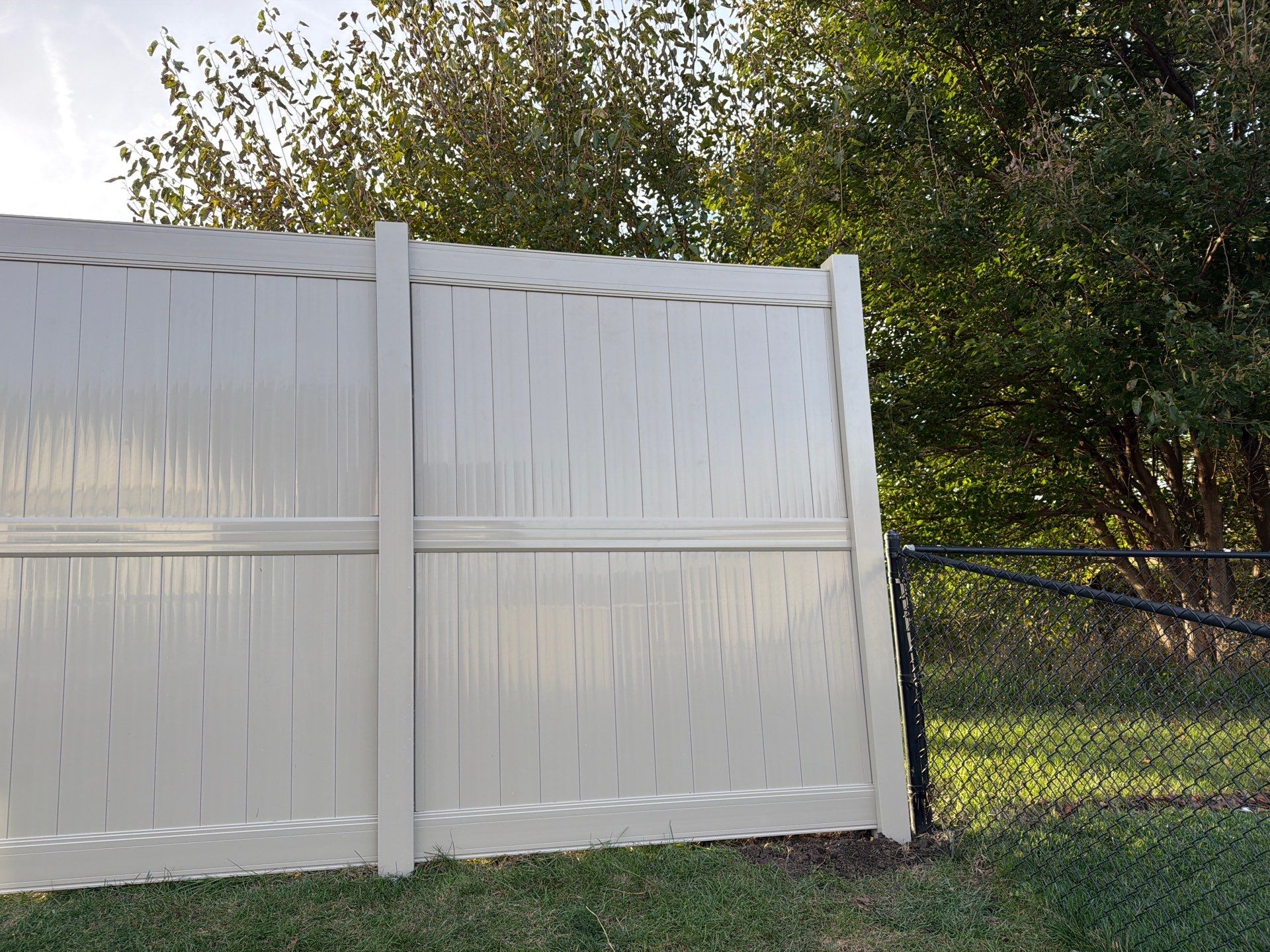 Adobe Vinyl Privacy Fence and Gate Installation in Cedar Falls by Perfect Picket Fence and Stain