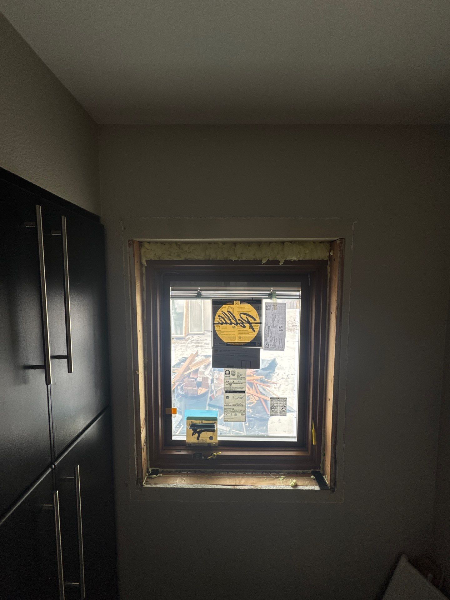 Black-Frame Pella Lifestyle Upgrade on a Partial Brick Home by United Windows and Siding LLC