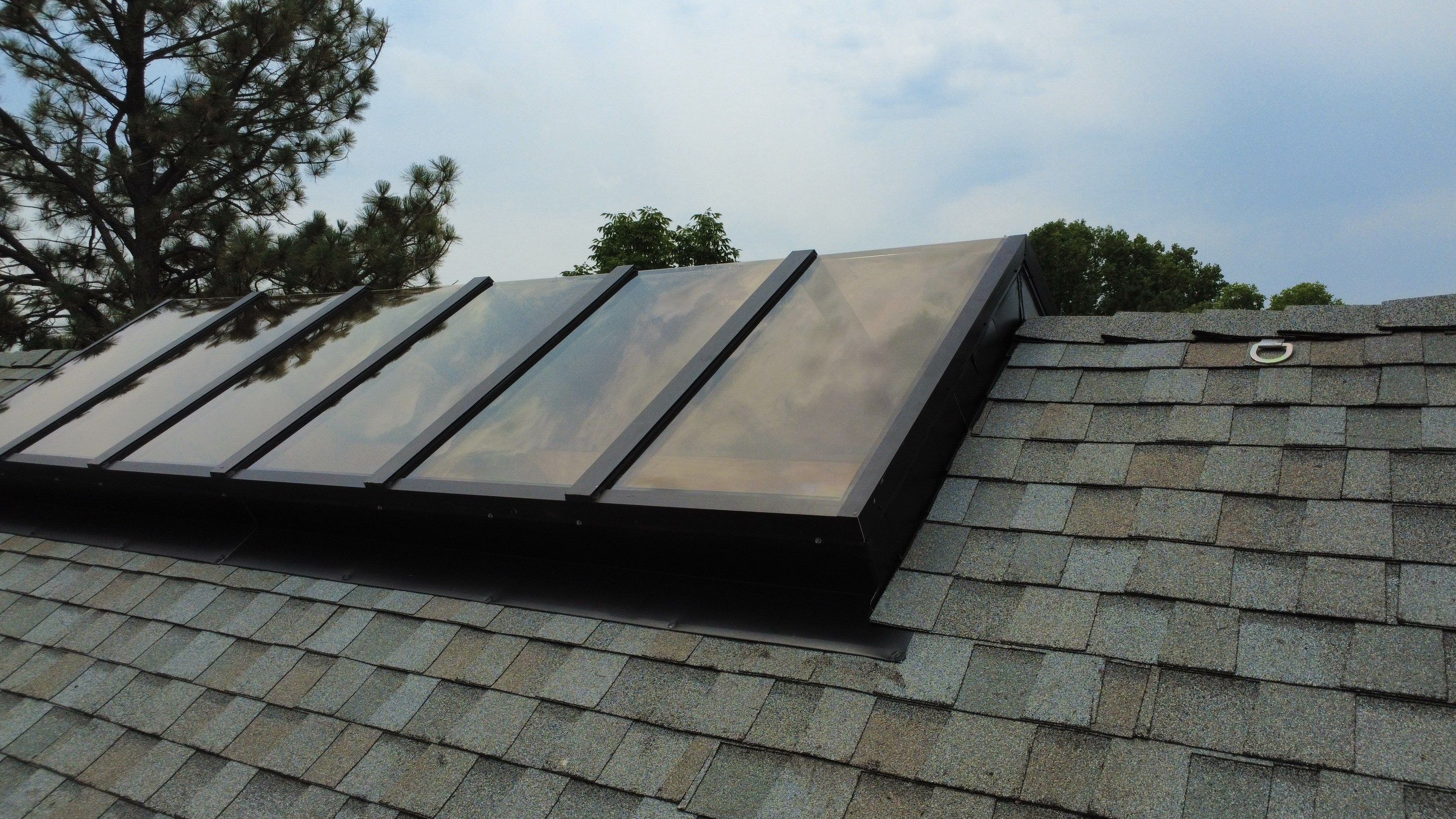Asphalt Shingle and Skylight Replacement Project in Denver, CO by Blue Peaks Roofing LLC 