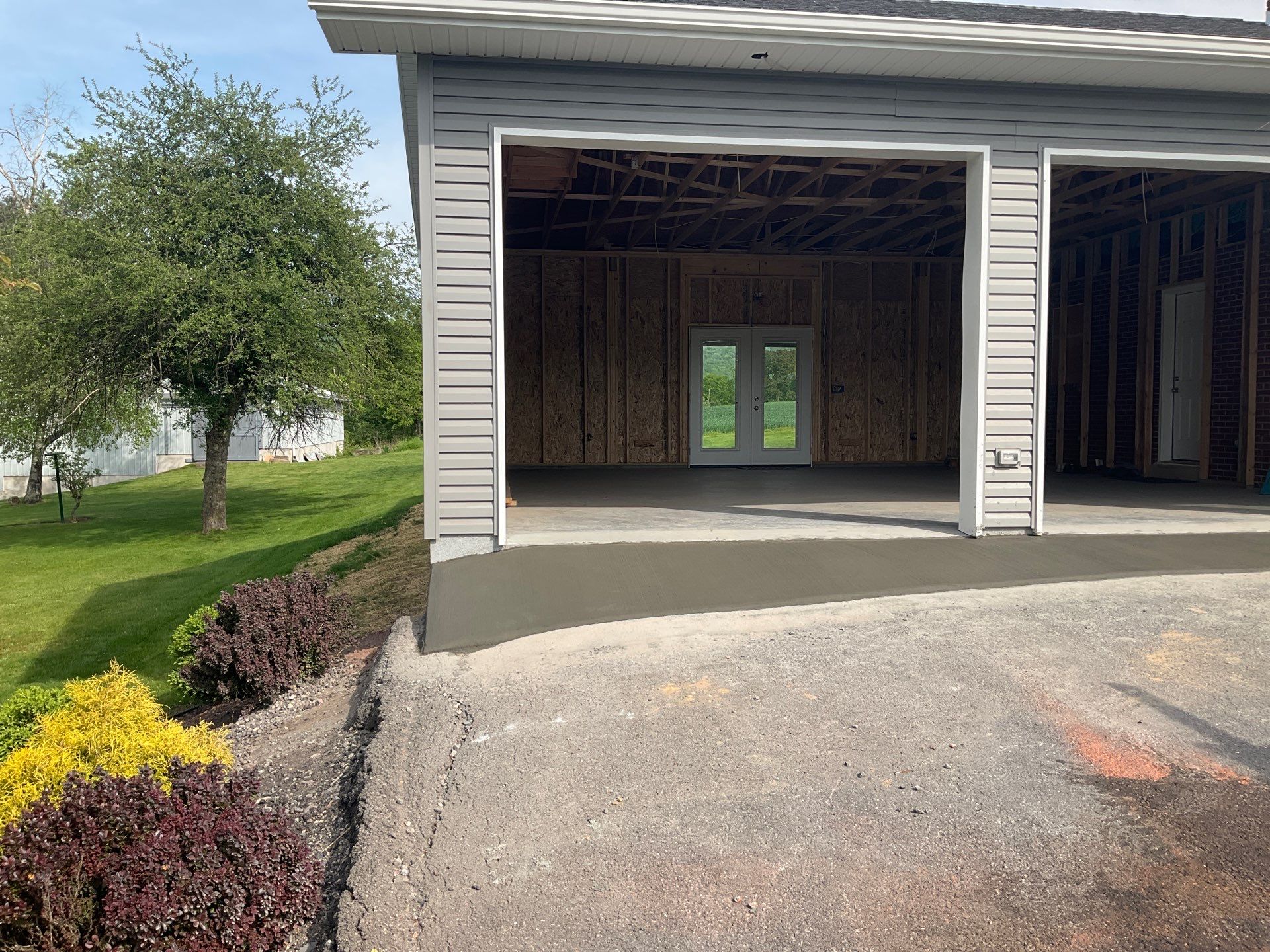 Tower City Residential Addition Featuring Gray Vinyl Siding and Garage by Esh Builders