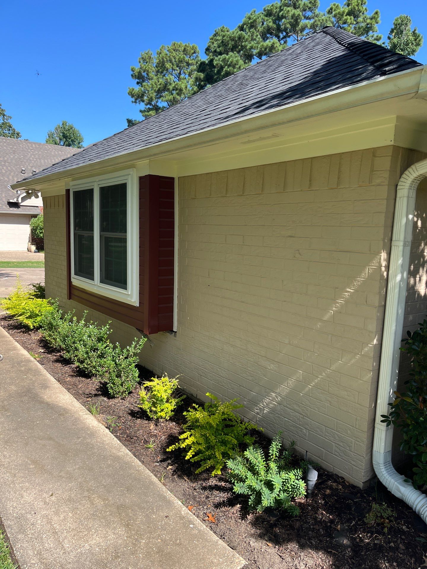 Exterior Painting in Tyler, TX | Brick House with White & Blue Finish by Quality Coats Painting