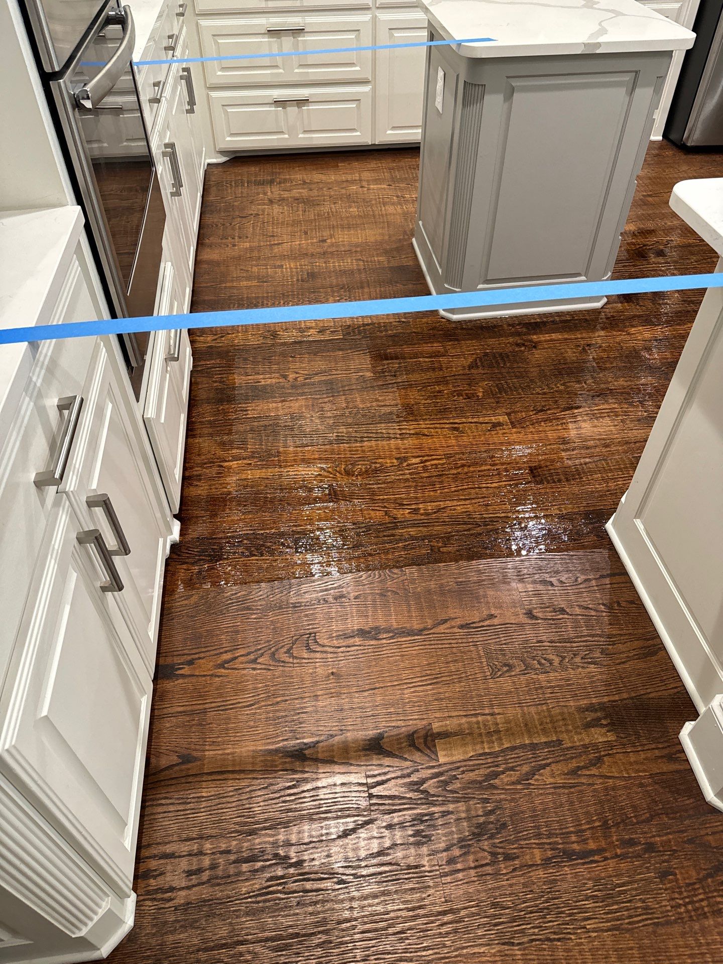 Dishwasher Flood Repair by Fine Line Flooring Inc.