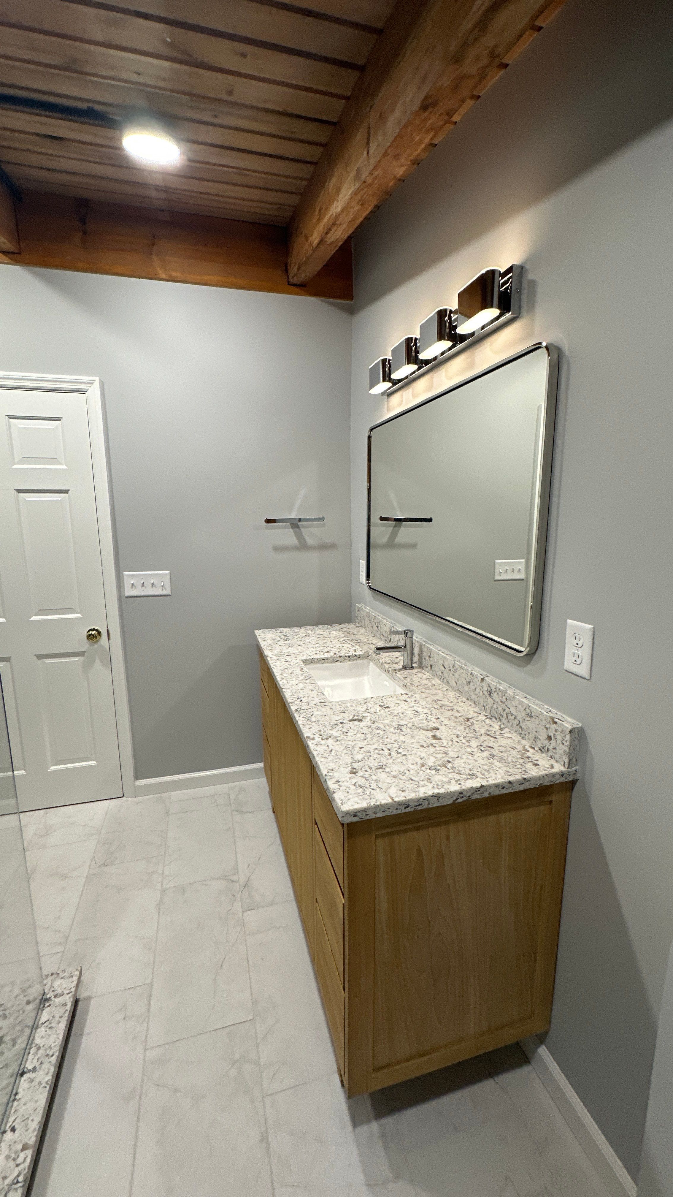 Brandt Double Bathroom Remodel by Integrity Tile and Home LLC