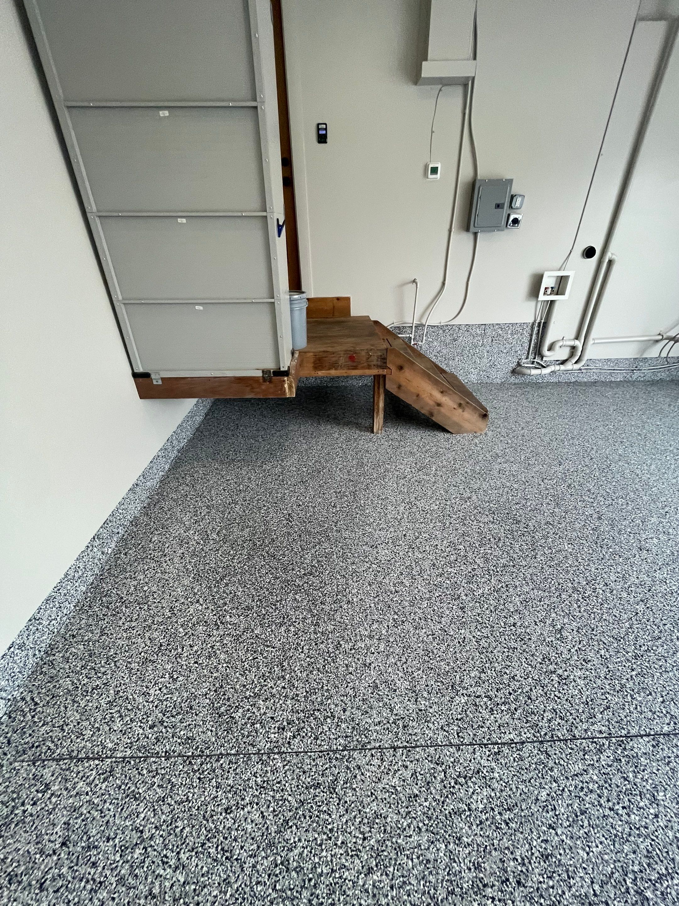 Domino Flake Floor Coating and Crack Repair in Chancellor by Select Painting, Coatings & Garage Cabinets