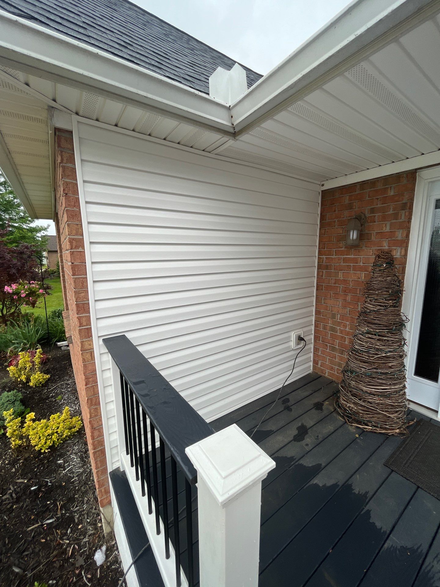 Exterior Installation using Onyx Black Durations and White Siding by WIW Enterprises Inc