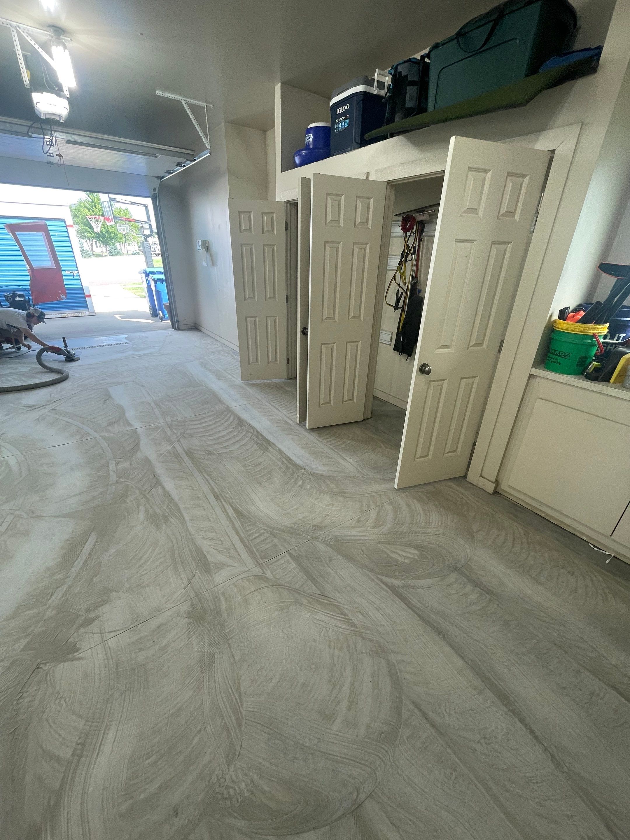 Coyote Flake Garage Floor Coating in Sioux Falls with Trench Drain by Select Painting, Coatings & Garage Cabinets