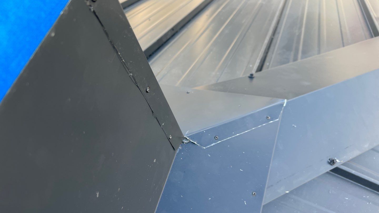 Commercial Roofing Installation using 12" Prolok metal and hidden gutters! by Top Notch Roofing Inc