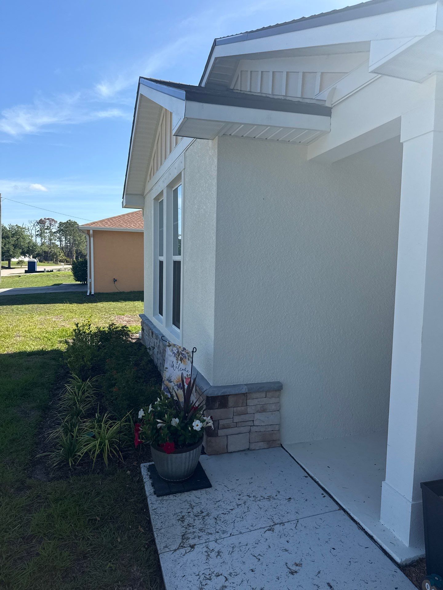 6-inch K-style White Seamless Gutters with Downspouts in North Port, FL by Gutter Professors