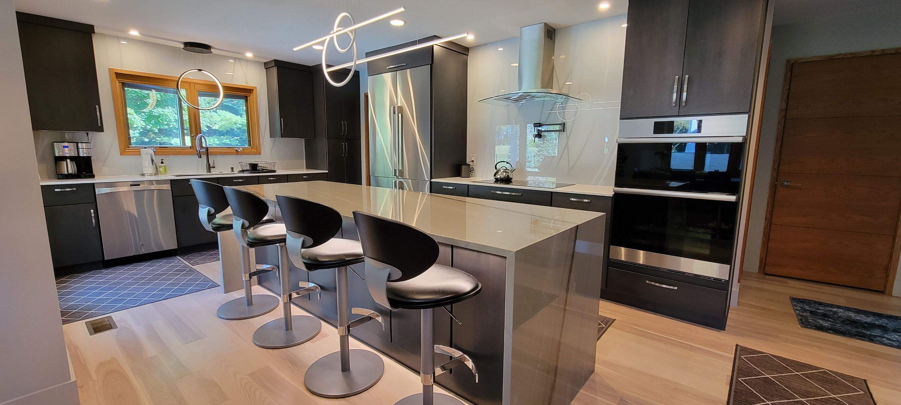 Kitchen Remodel using IMAGIO Misty Curves Solid Glass Backsplash by IMAGIO
