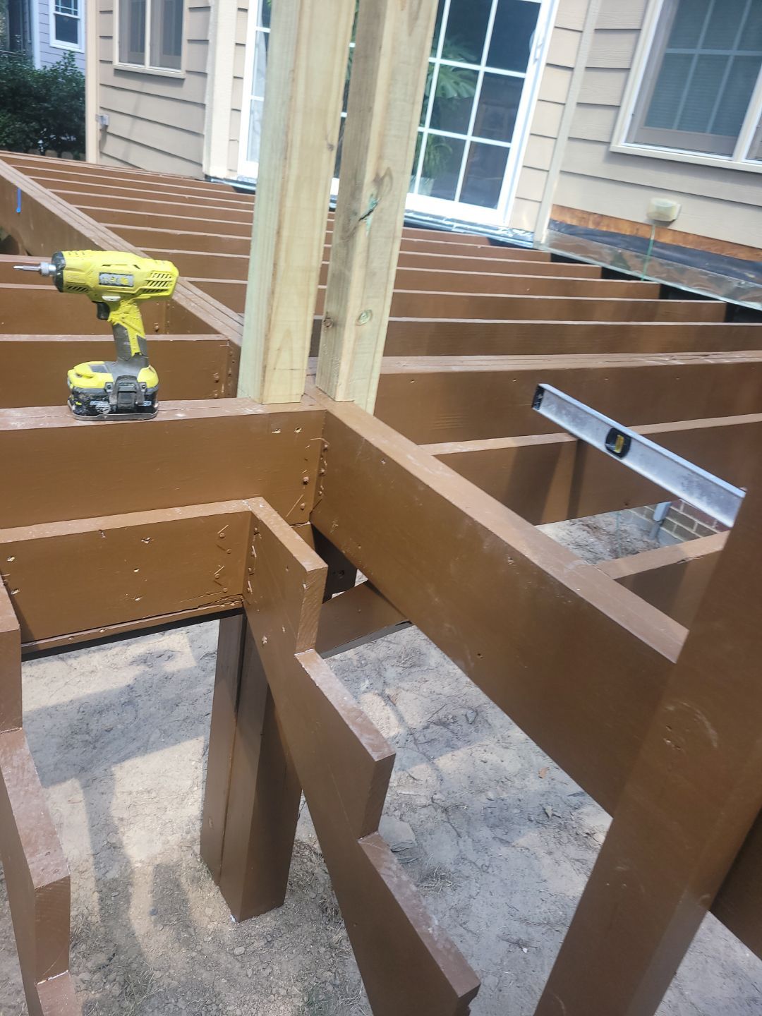 Fuquay-Varina Outdoor Upgrade – Composite Deck & Paved Landing by Elite Remodeling and Design LLC