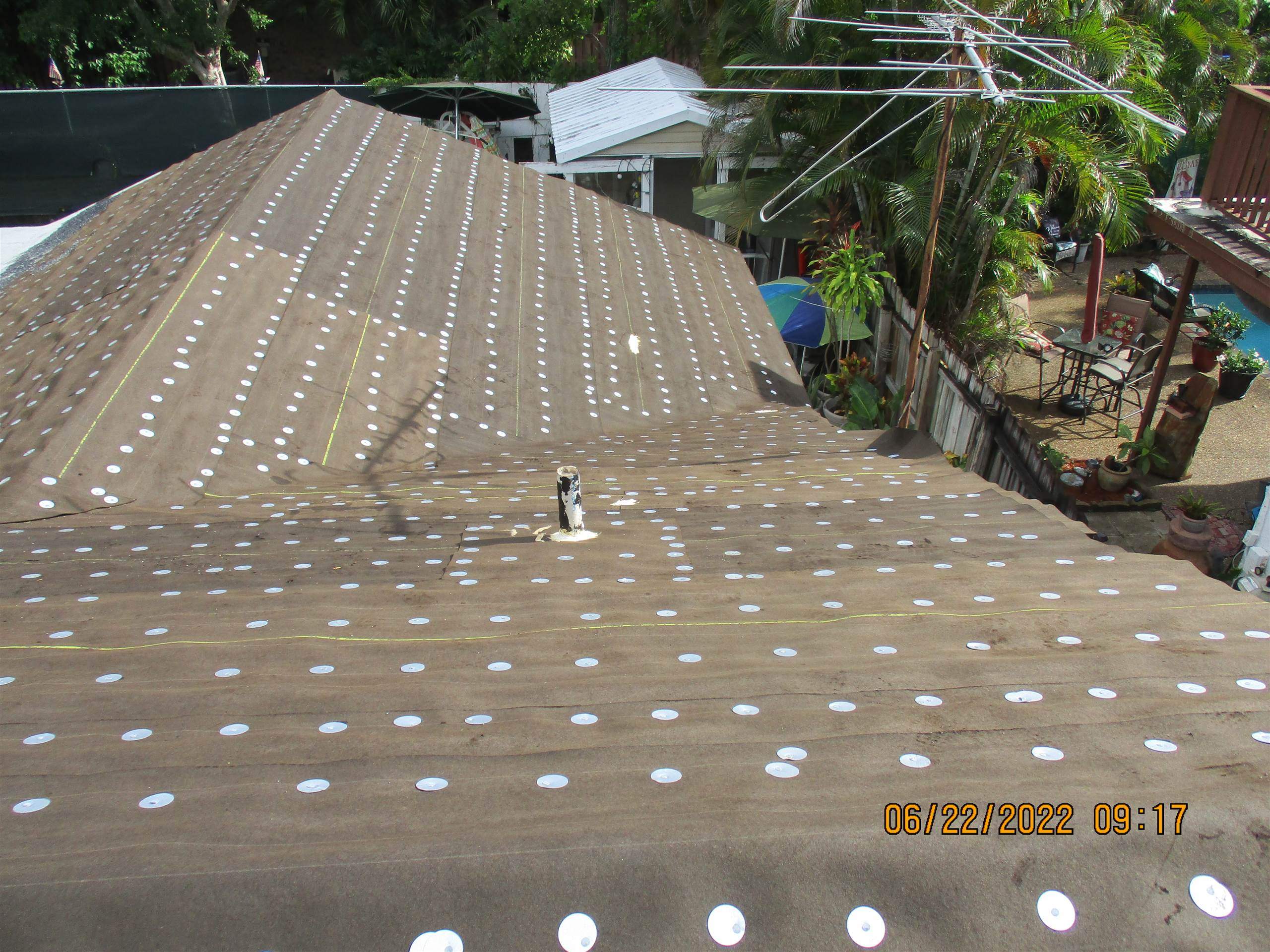 Residential Roofing Installation using 1.5" Nail Strip 24ga Solar White Kynar Coated Standing Seam Metal Panels by Morton Roofing, Inc.