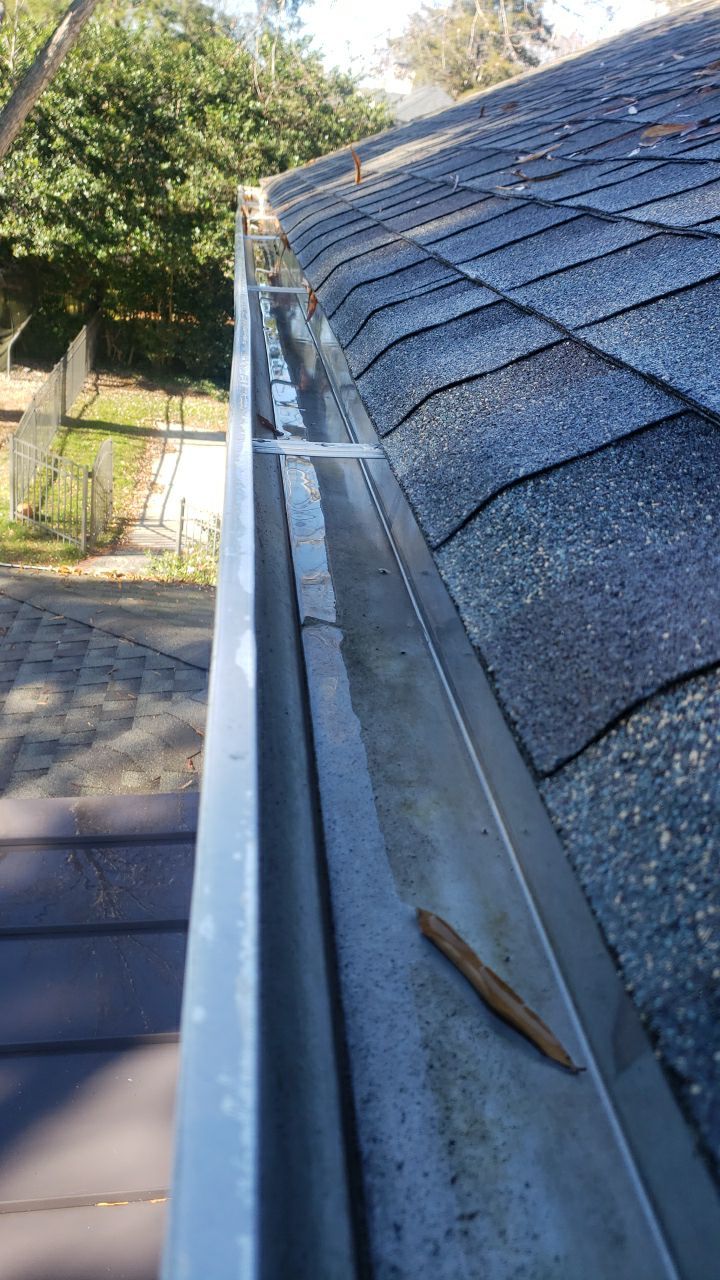 Sara Gutter cleanout using water by Power Wash Masters LLC