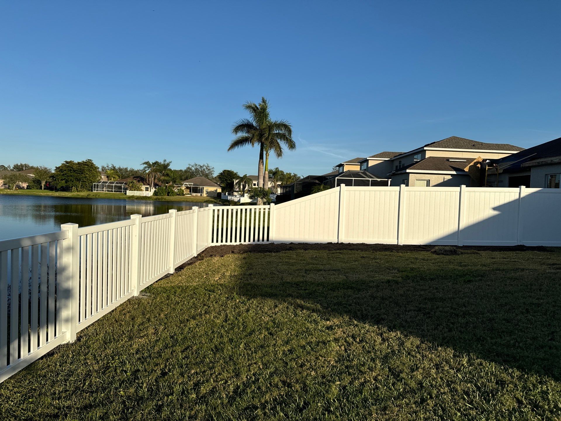 Vinyl Picket Fence Installation using 6Ft White Vinyl Privacy Fence with a 4Ft White Clearwater Picket Fence by Asap fence and gates, LLC