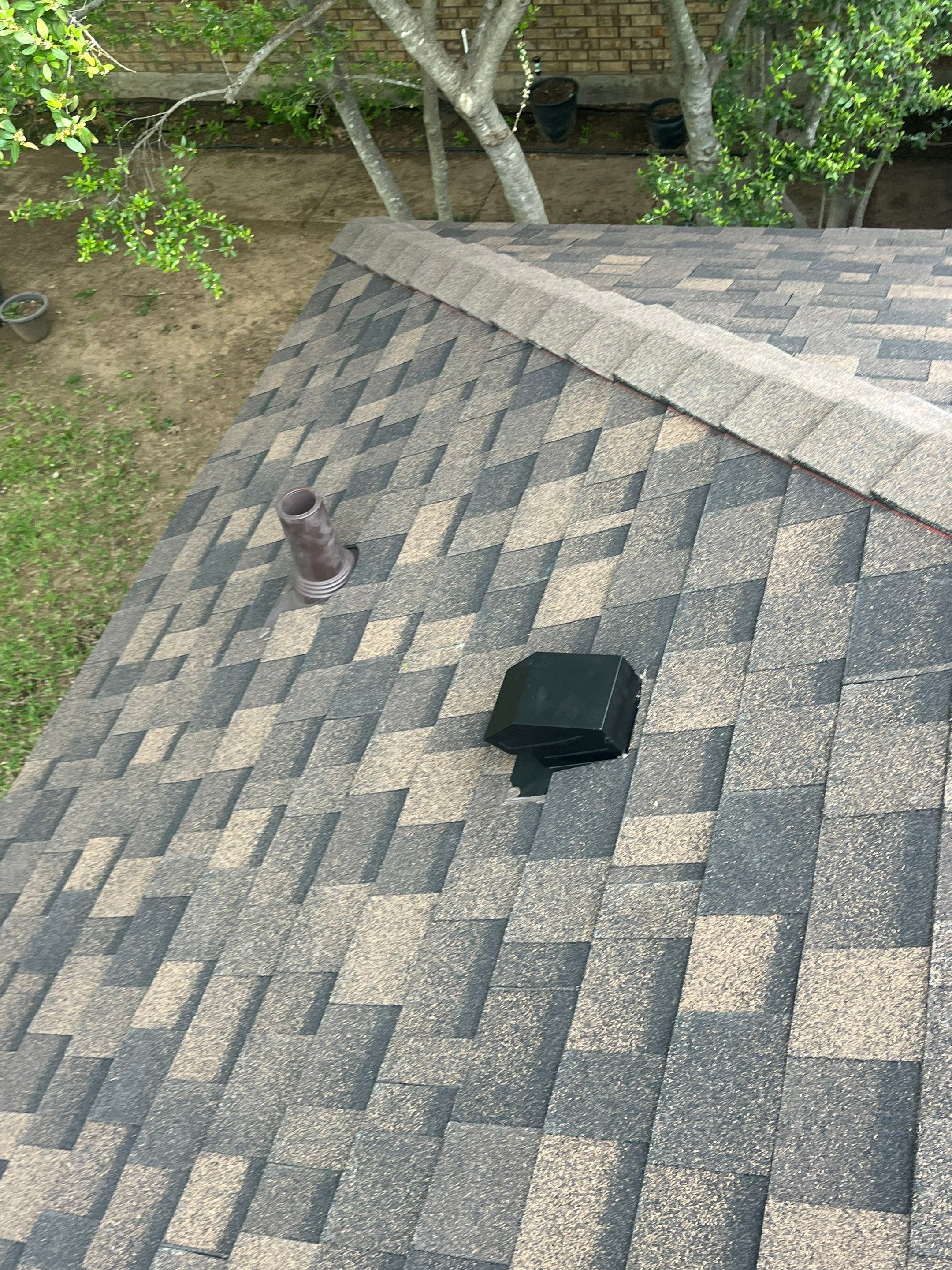 Brown brick with IKO Shadow Brown by Tejas Roofworks + Restoration