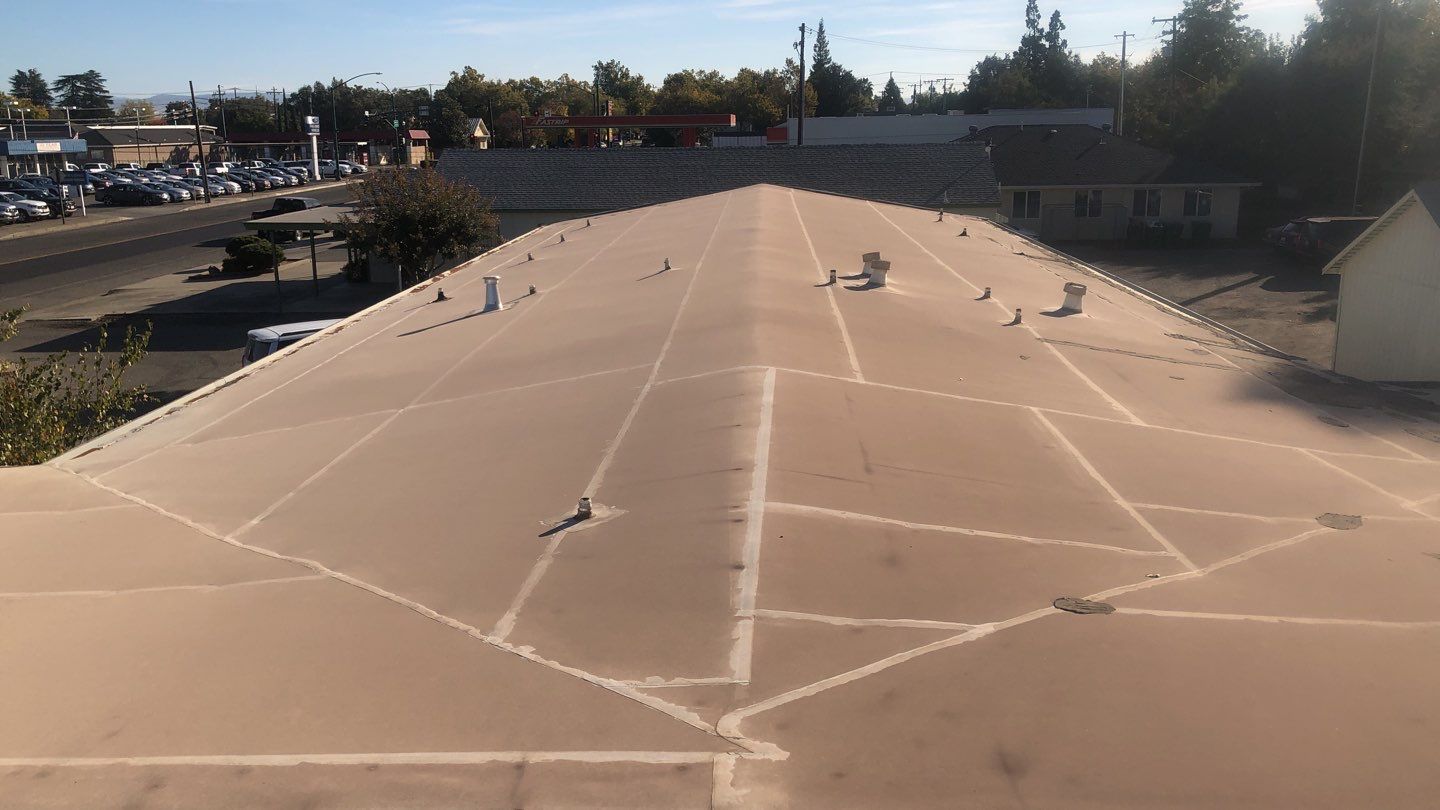 Spray foam and coatings using Conklin Benchmark/PUMA XL coatings and spray foam by Straight Edge Roofing Inc