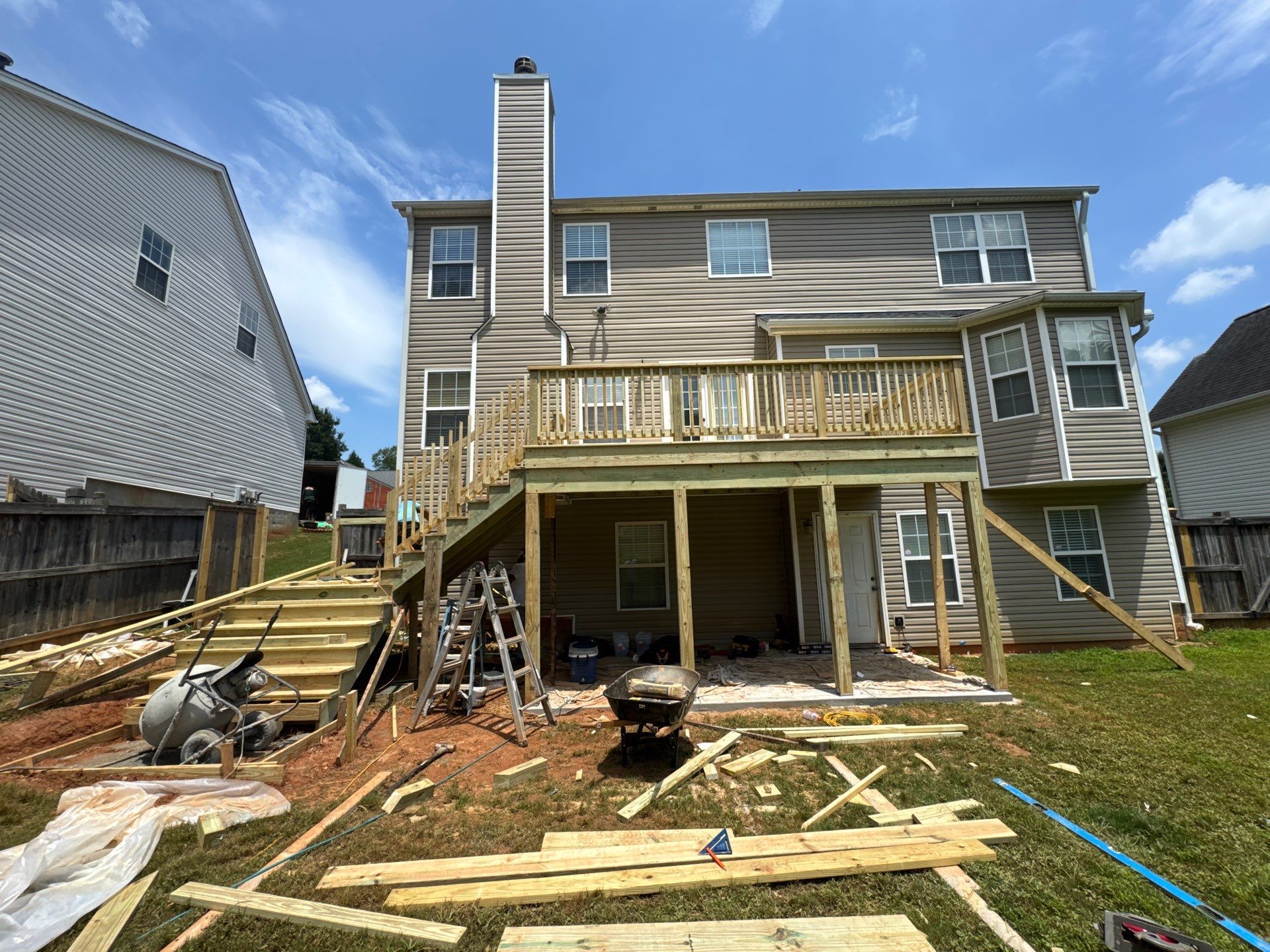 Backyard Deck Expansion & Custom Staircase Installation in Suwanee. by Swift Home Renovations