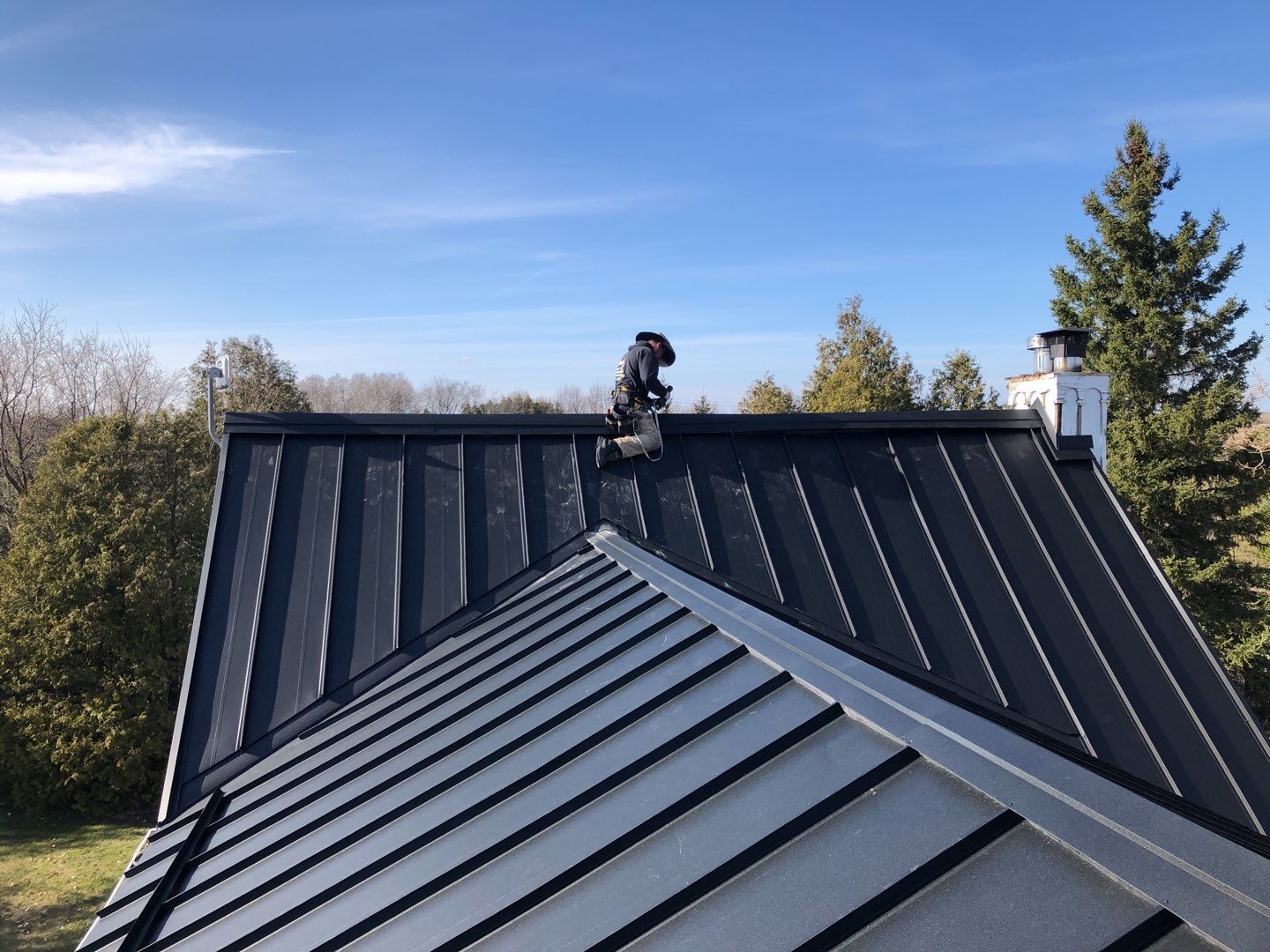 Residential Roofing Installation using 16" Standing Seam Panels by Jay Carter Roofing & Sheet Metal