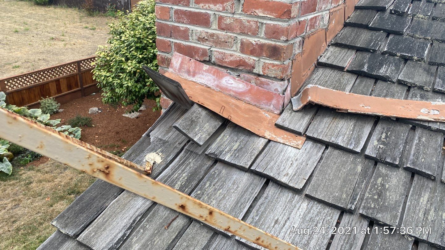 Refurbish and repair shake roof to get ready to sell by Straight Edge Roofing Inc