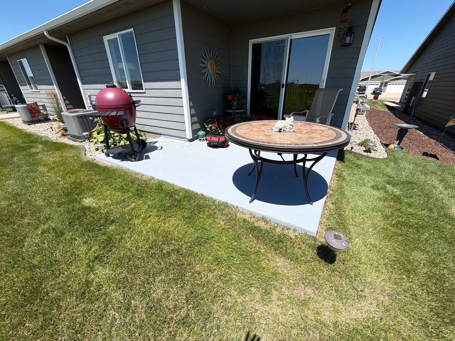 Starry Evening Concrete Patio Coating Installation in Tea by Select Painting, Coatings & Garage Cabinets