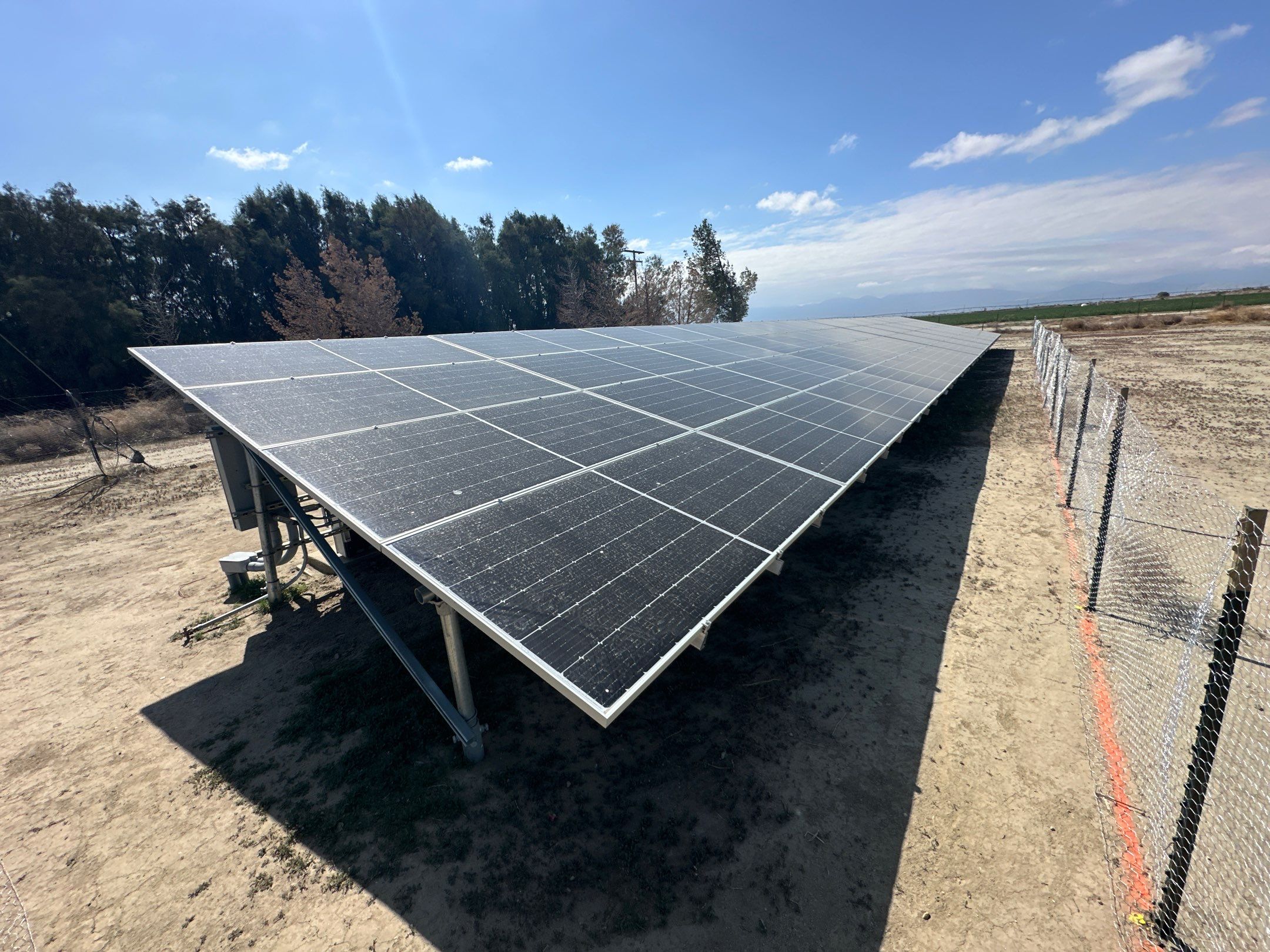 Large-Scale Ground-Mount Solar and Tesla Powerwall Battery Installation by AWS Solar