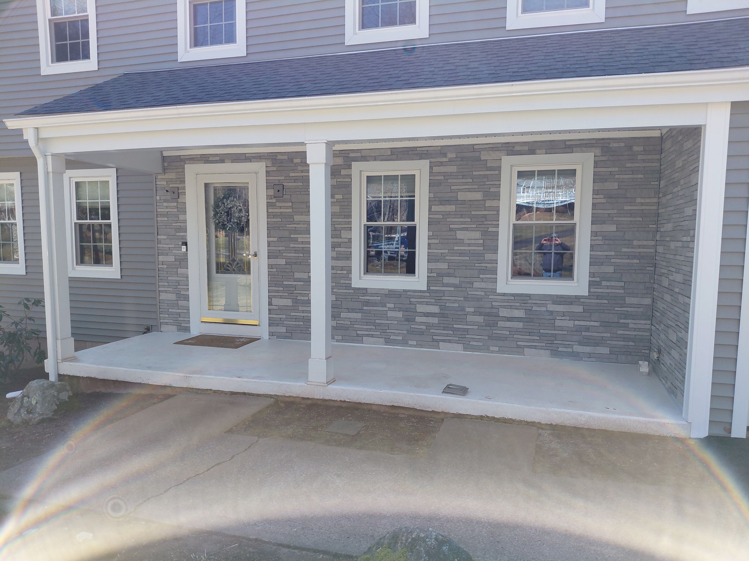 Glastonbury Exterior Renovation with Castle Stone Siding & Stone Entry Upgrade by Turner Home Improvement Contractors, LLC