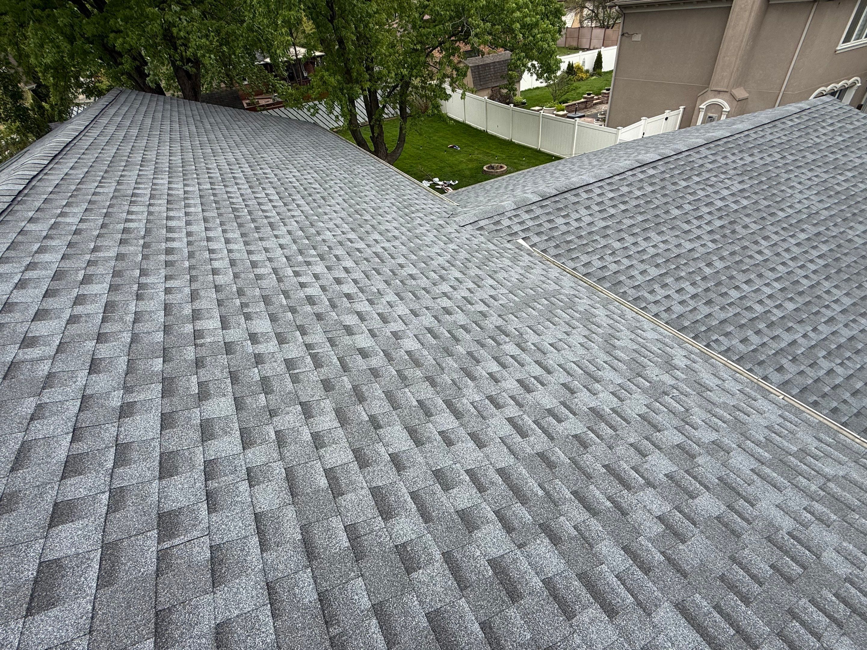 Roof replacement and chimney flashing by Optimal Home Improvement 