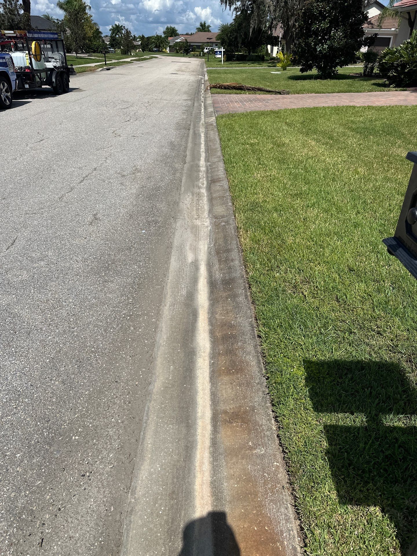 Paver Driveway, Entryway, Sidewalk, and Street Curbing Cleaning in Winding River Community, Bradenton, FL by Sunshine AquaWash