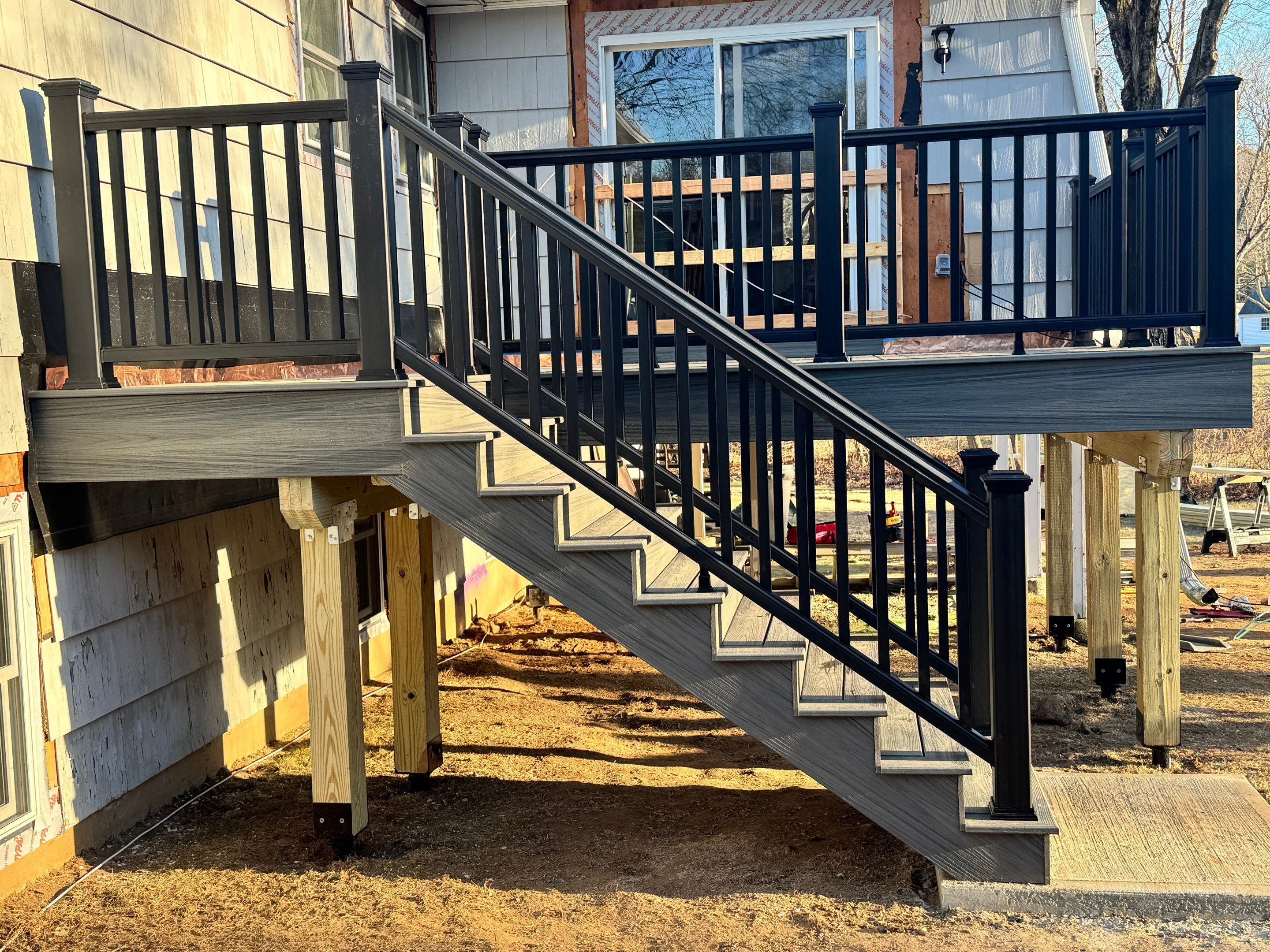 New Deck, Trex Tropical Island mist boards and Fascia. Black composite trex railing. by DiGiorgi Roofing and Siding Inc