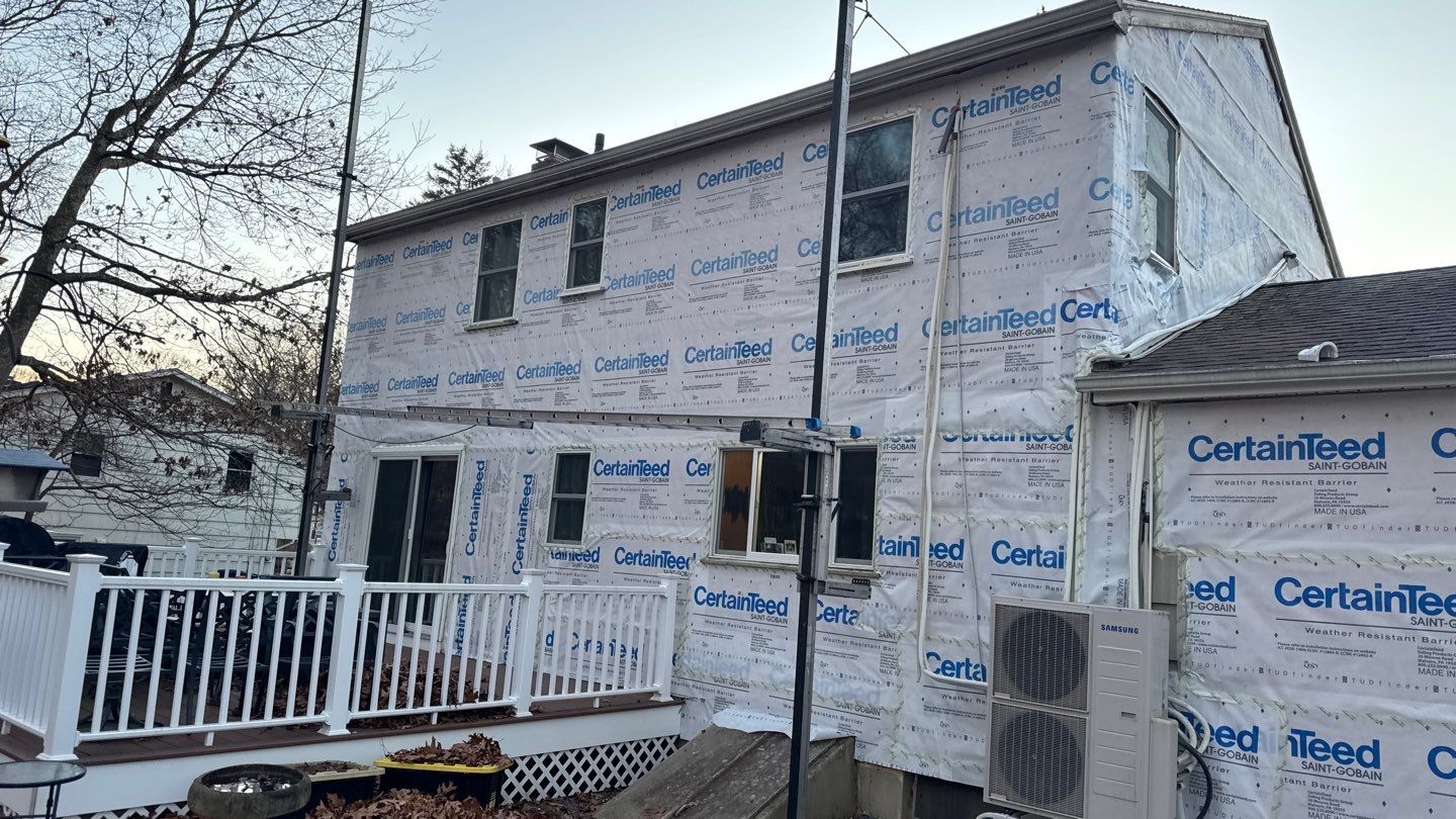 Siding Transformation with Certaplank S/7 insulated Herringbone, and Cert Monogram D/5x12' Dutchlap Wedgewood Blue by DiGiorgi Roofing and Siding Inc