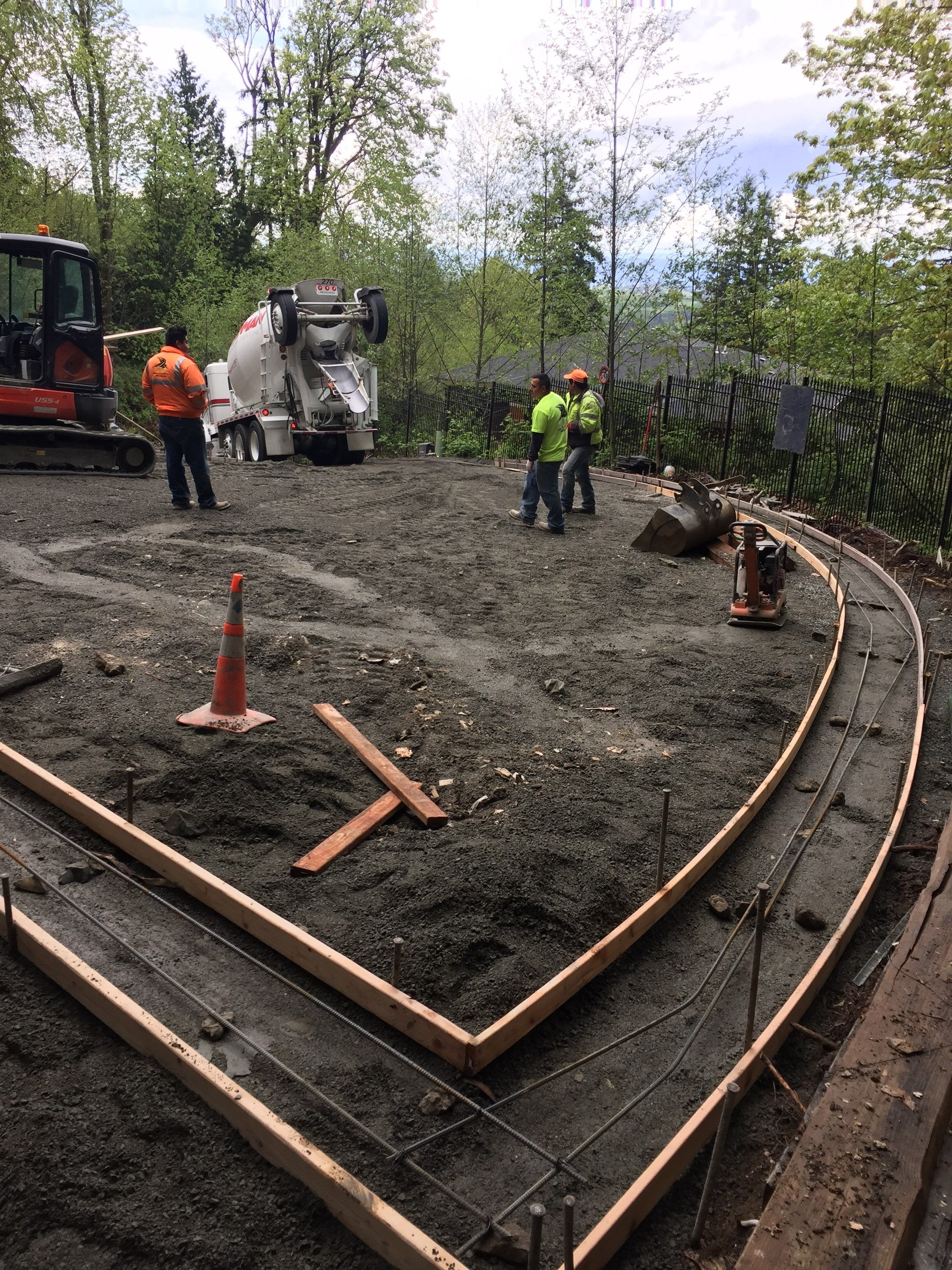Asphalt Driveway and Stamped Concrete Patio Finish  by Jireh Asphalt & Concrete Inc 