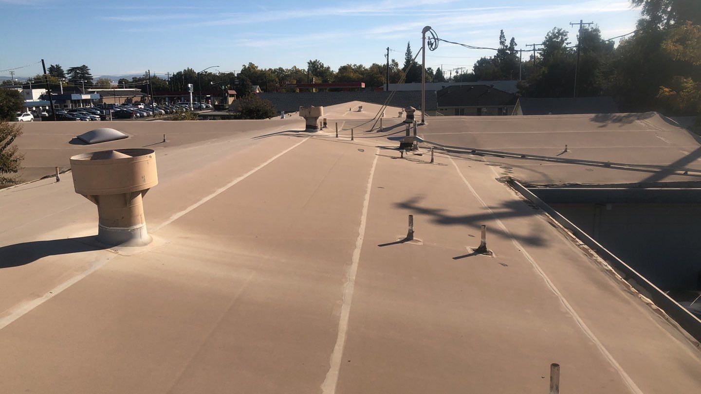 Spray foam and coatings using Conklin Benchmark/PUMA XL coatings and spray foam by Straight Edge Roofing Inc