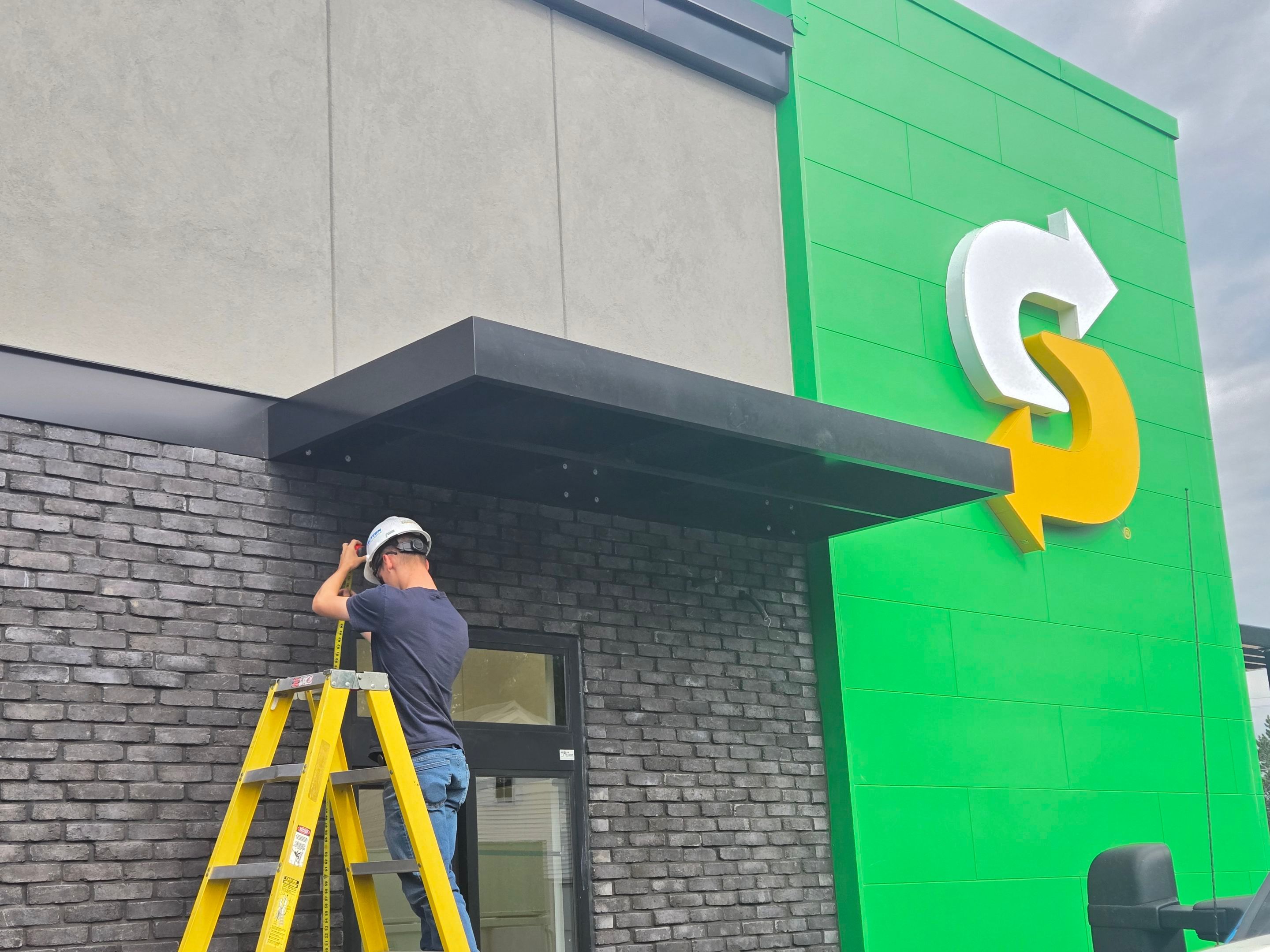Subway Awning Installation in Granger by Hayes Design co
