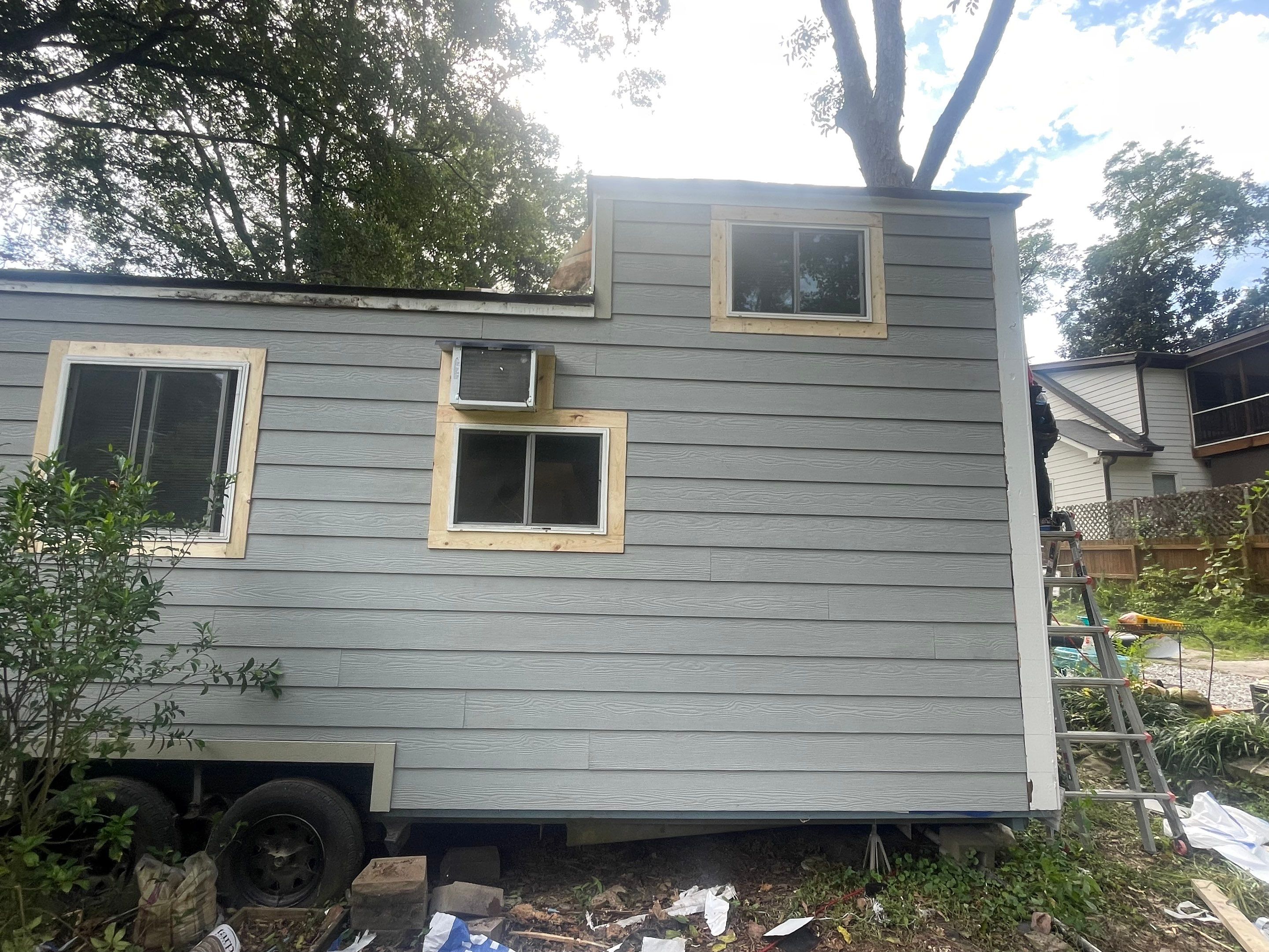 tiny home remodel- siding,paint,roofing by Nailed It Roofing & Remodeling LLC