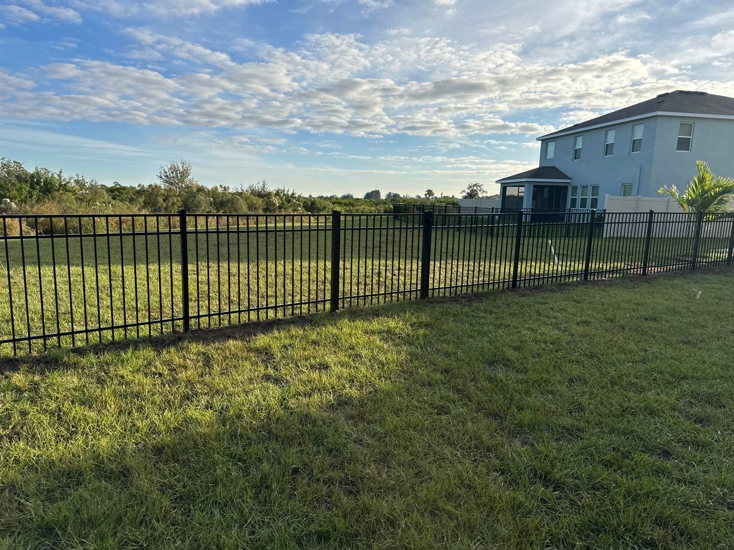 Vinyl Fence Installation using Vinyl Fence and a Black 3 Rail Aluminum Fence by Asap fence and gates, LLC