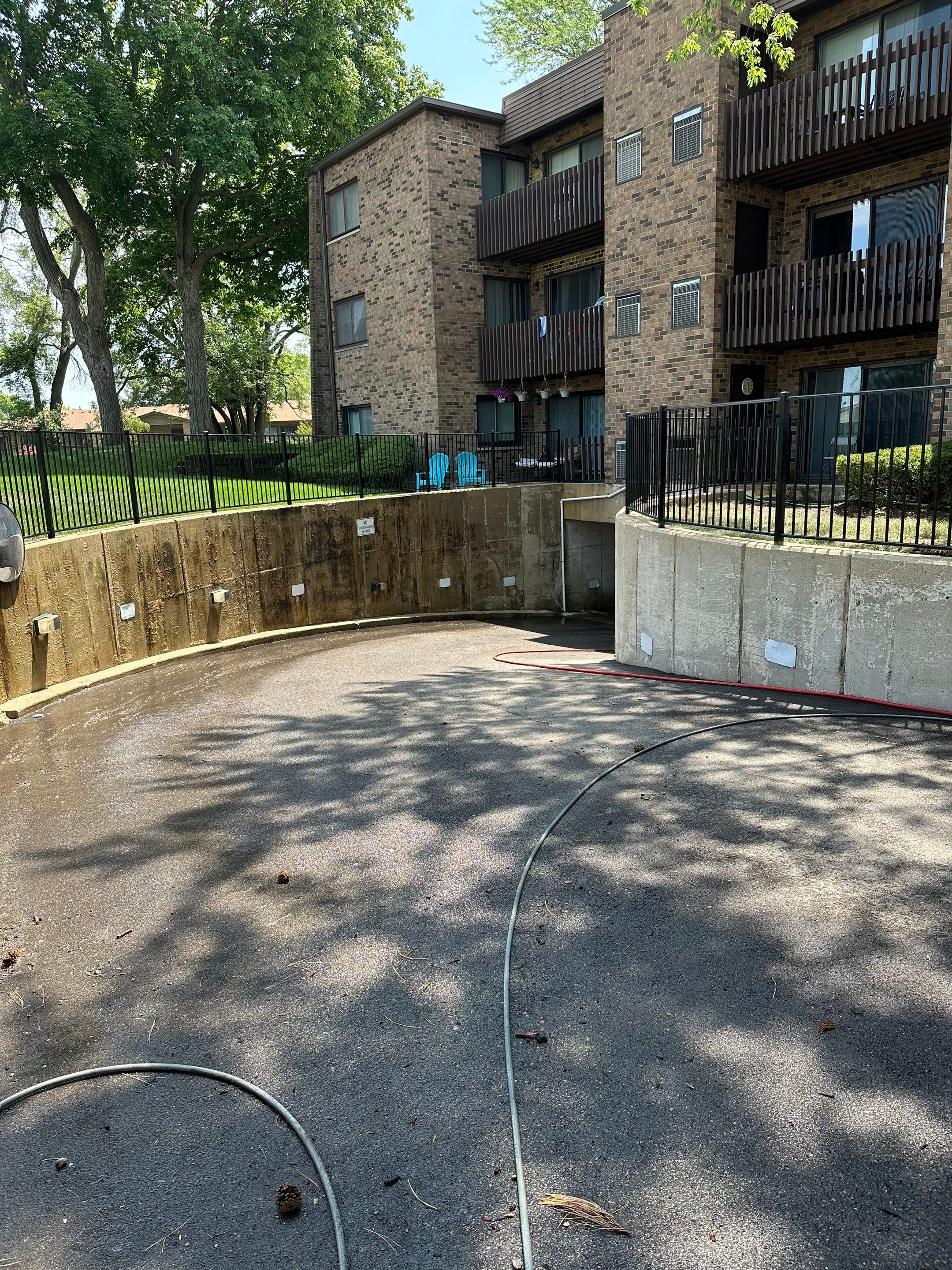 Parking garage using Hot water by Northern Power Washing LLC.