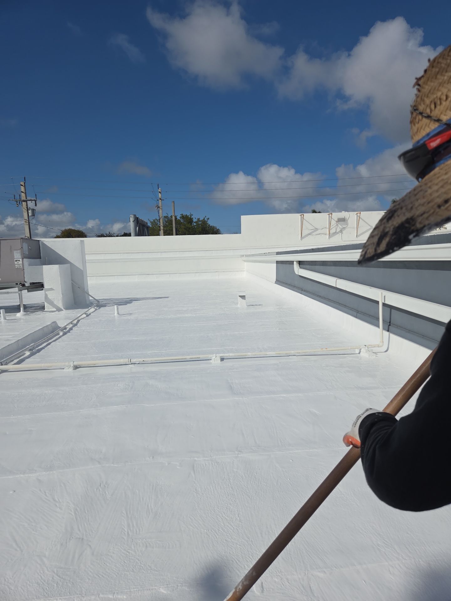 Commercial Flat Roof Restoration Using Silicone Coating in Hallandale Beach by Aastro Roofing
