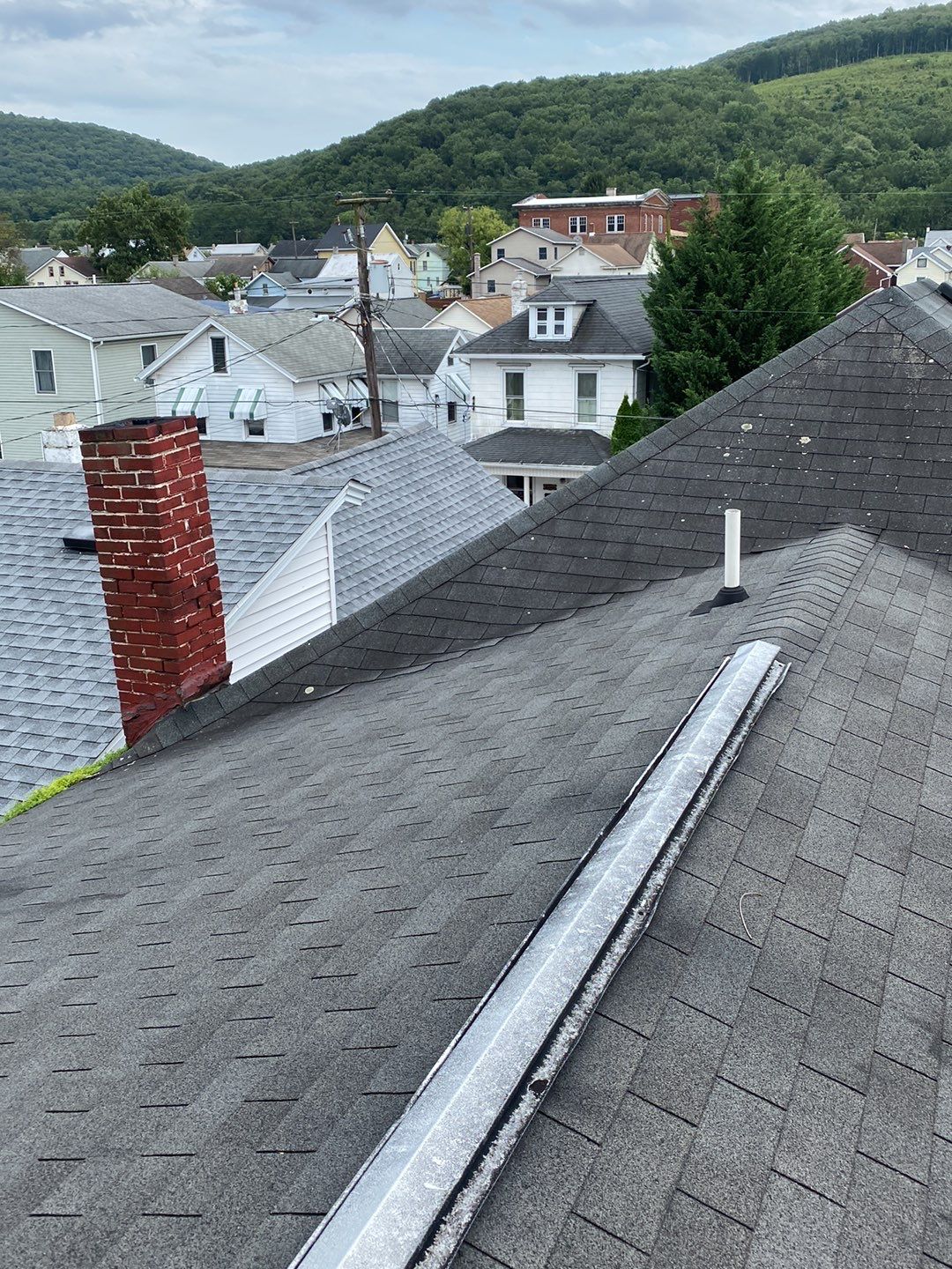 Charcoal Metal Roof & Blue Siding — A Refreshing New Look by Esh Builders