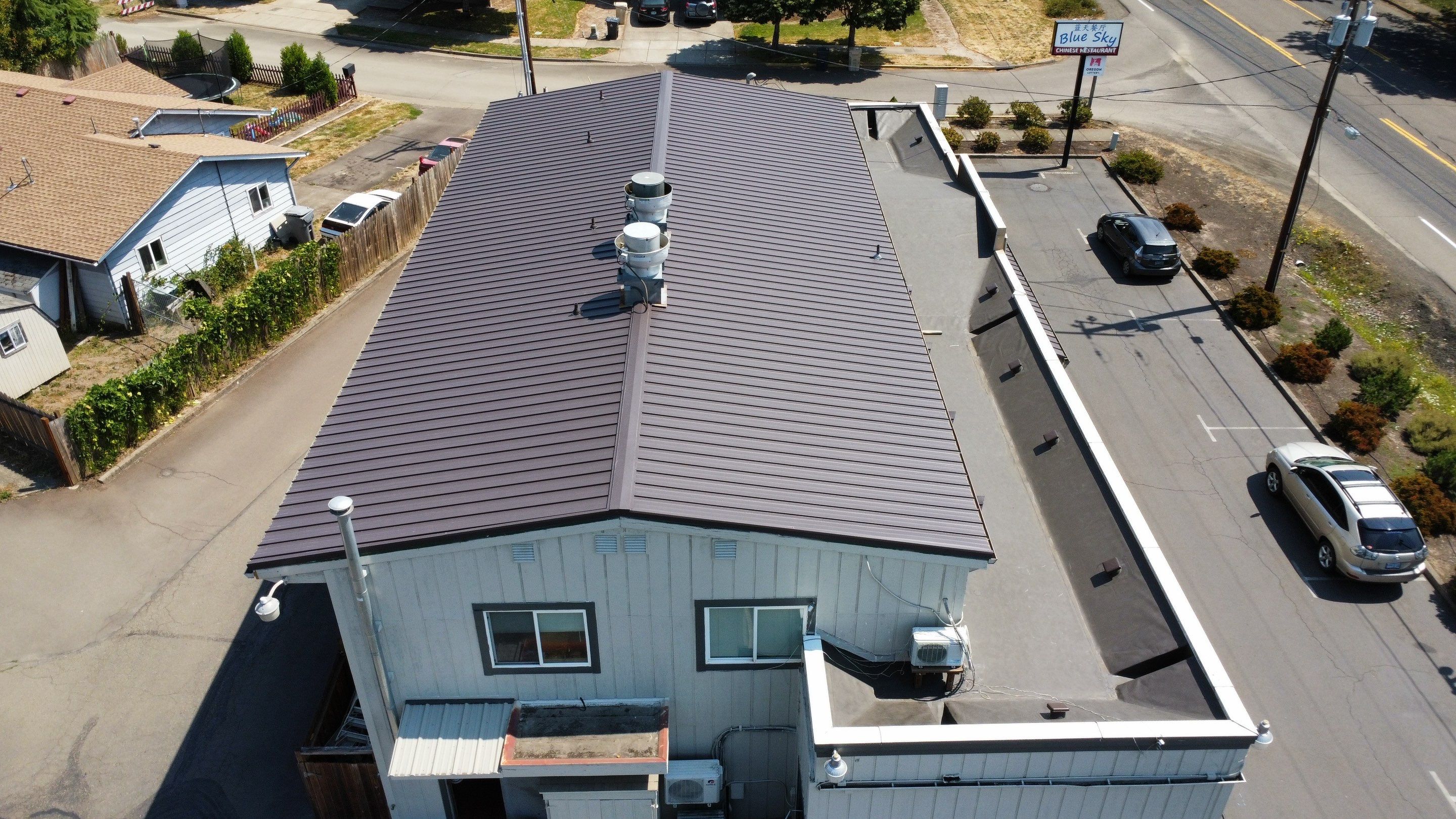 Commercial Flat Roof Installation using Bruce and Dana Snap Lock Metal (Color: Brown) by Orezona Building & Roofing Company, Inc.