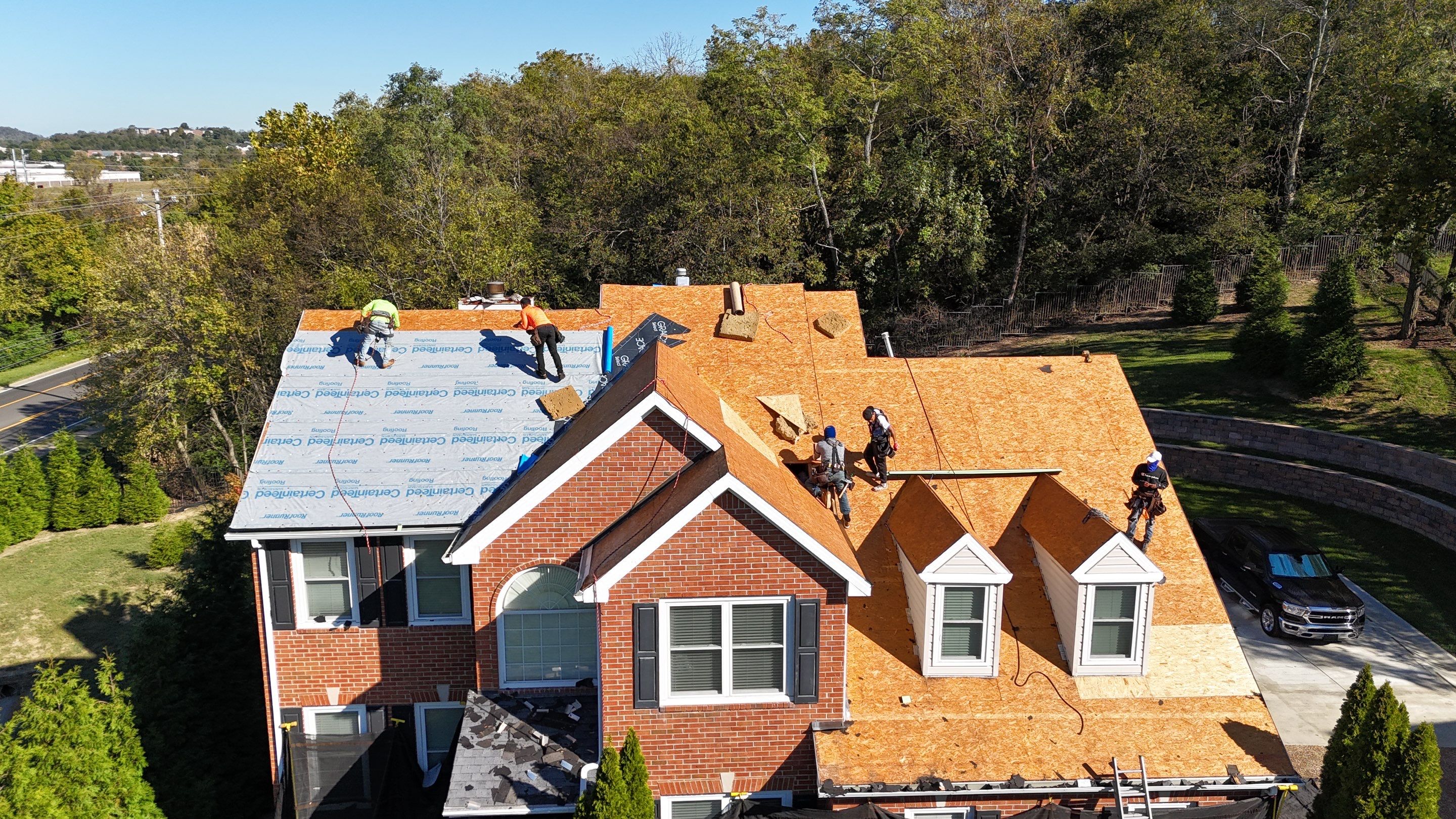 Charcoal Black Re-Roof & Gutters by Royal House LLC
