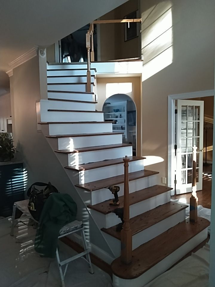 Stairway Installation using Red oak modern railings by House Custom Carpentry, LLC