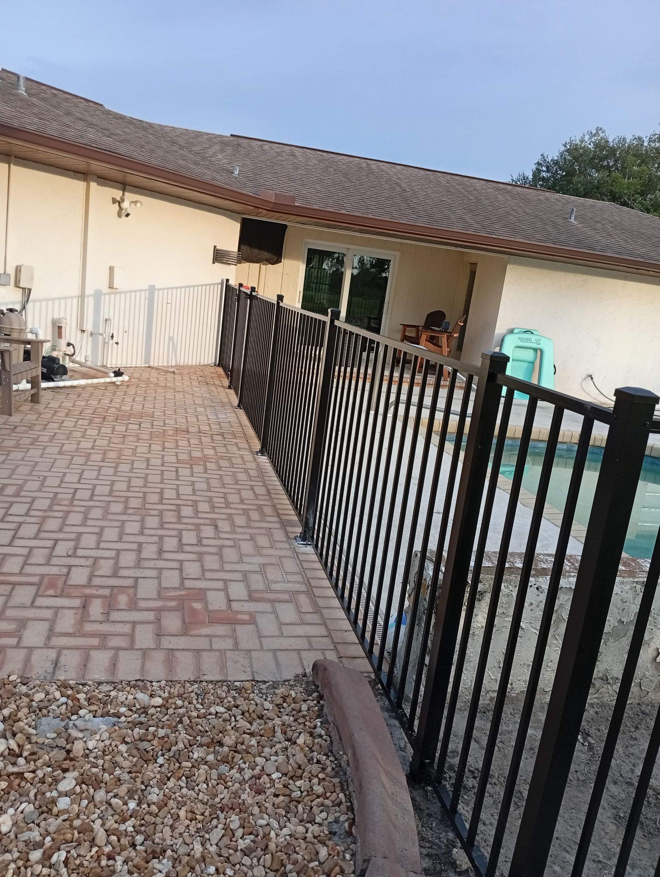 Black Aluminum Pool Safety Fence Installation in Punta Gorda by True Fence LLC
