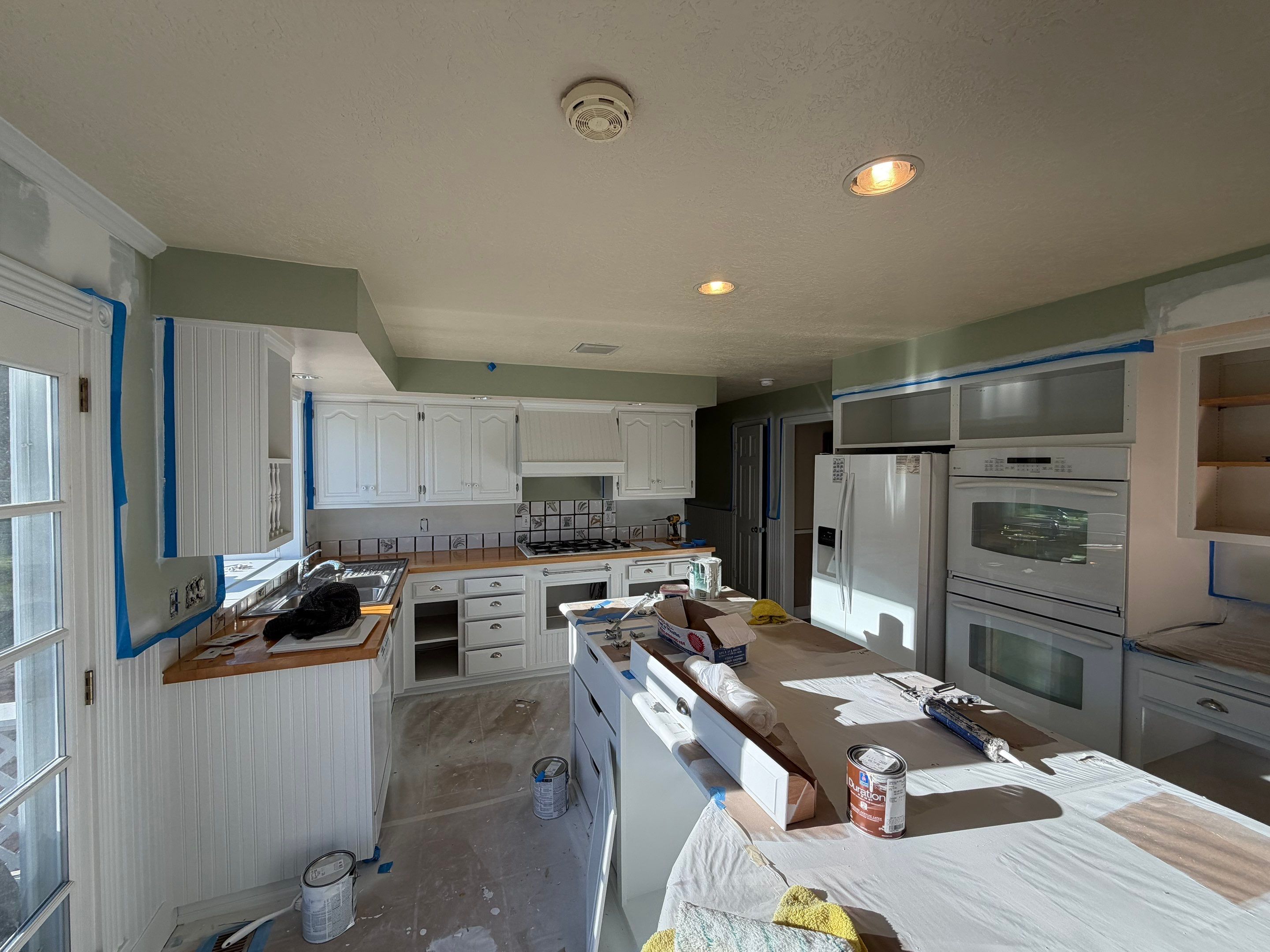 Kitchen Cabinets Painting by Handyman State LLC